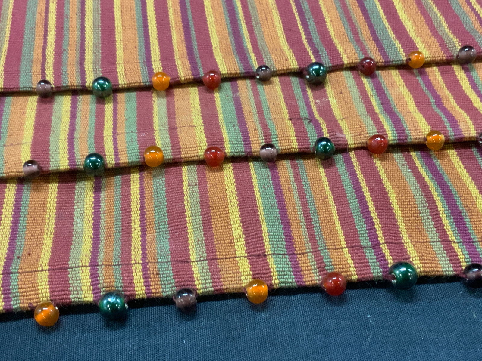 Heavy Cotton Placemats with glass beads, 3: Striped Table Placemats. thick heavy textiles, cotton, edges have sewn beads, iridescent glass or resin. One placemats missing beads on one side. Up cycle textiles into arts and crafts. Measures 14.5