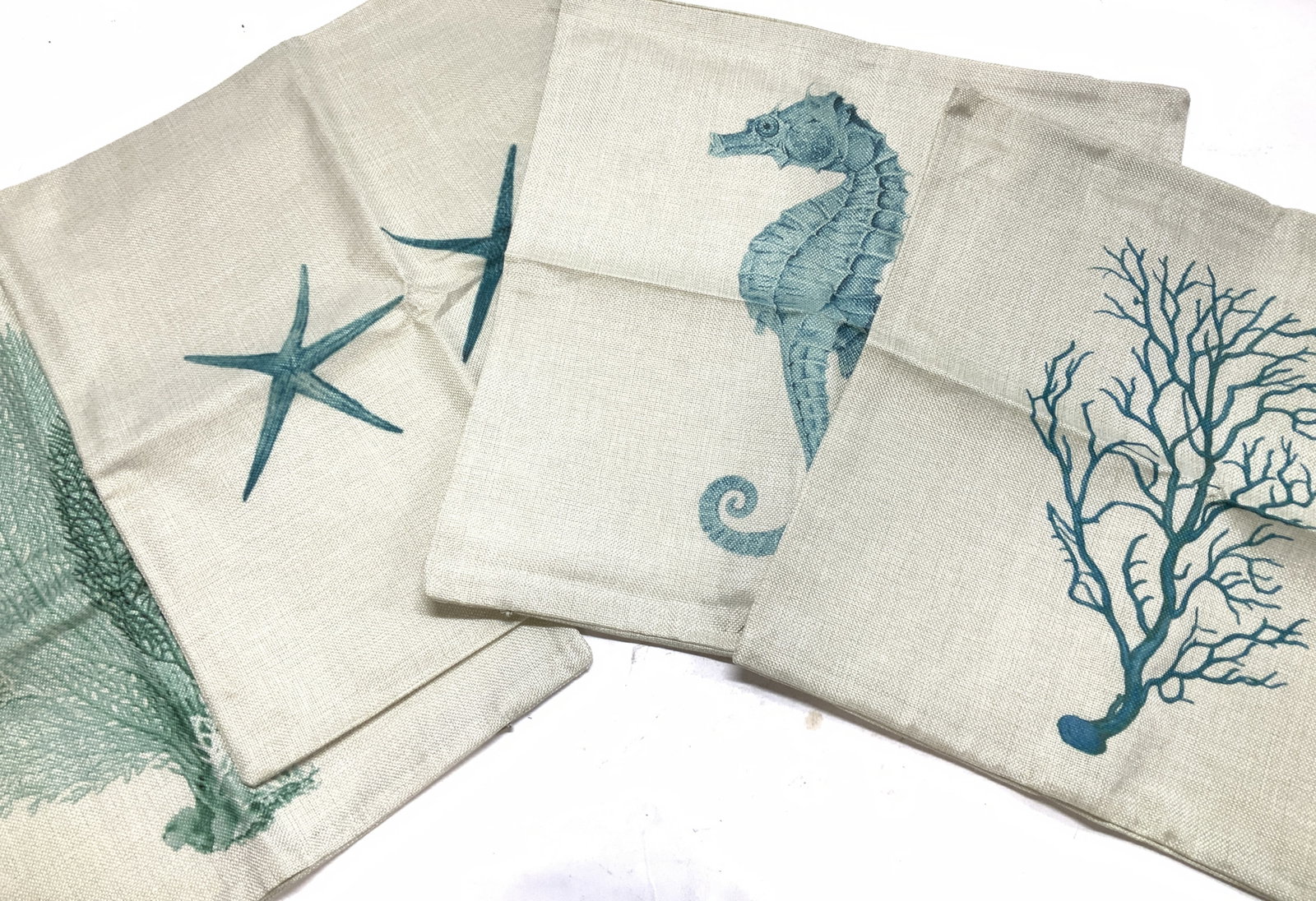 Set 4 HOSL Nautical Zippered Pillow Covers, NIP: HOSL ( Happy Online Shopping Life) pillow cases with zipper. Graphic print nautical images- starfish, seahorse, and coral. Pillow covers measure 17 x 16.5 in. New in cellophane packaging. Cotton & Lin
