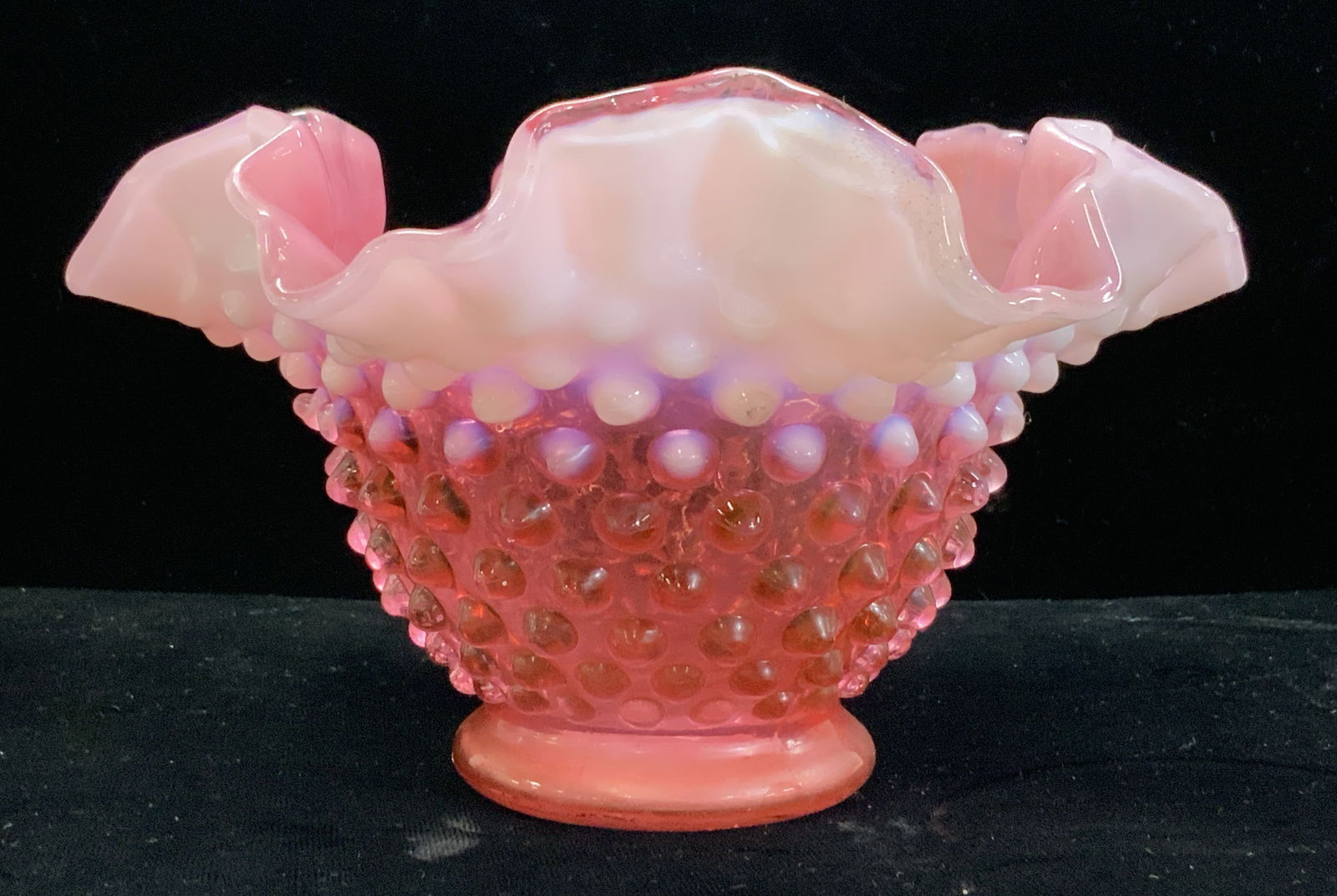Cranberry Hobnail Glass Bowl: Cranberry Hobnail handkerchief glass bowl, measures 7 x 4 in. A touch of white milk glass coloring along rim. Mid century piece. Hobnail Bowl, Cranberry Hobnail bowl, mid century glass bowl, candy bow