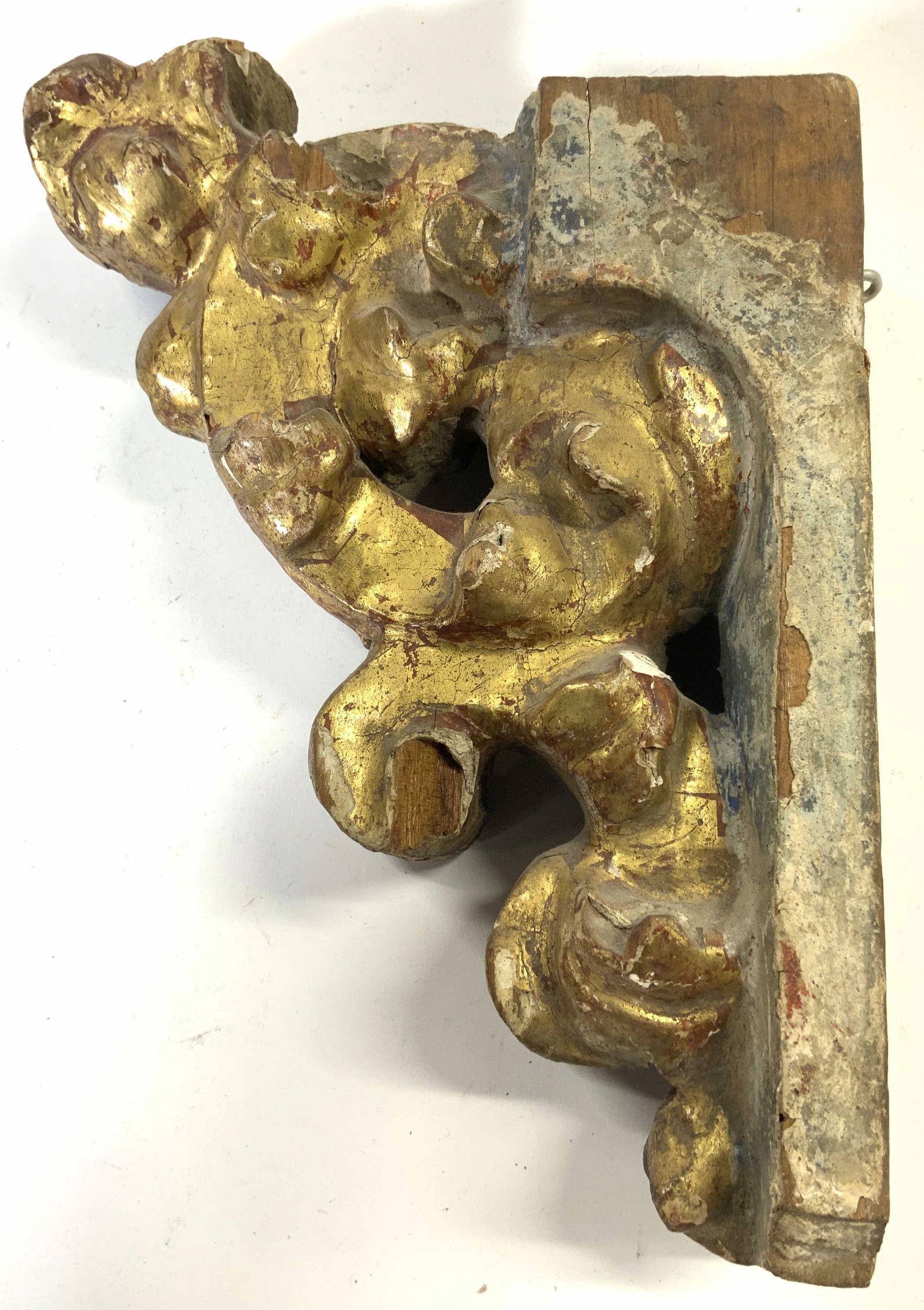 Vintage Ornate Gilt Wood Wall Mount Decor: Wall mount piece is vintage. Piece is gilt wood with leaf & scroll detail. Piece measures approximately 8.5 inches tall 7.5 inches deep 2.5 inches wide. Wall mount, wall mount decor, vintage wall moun