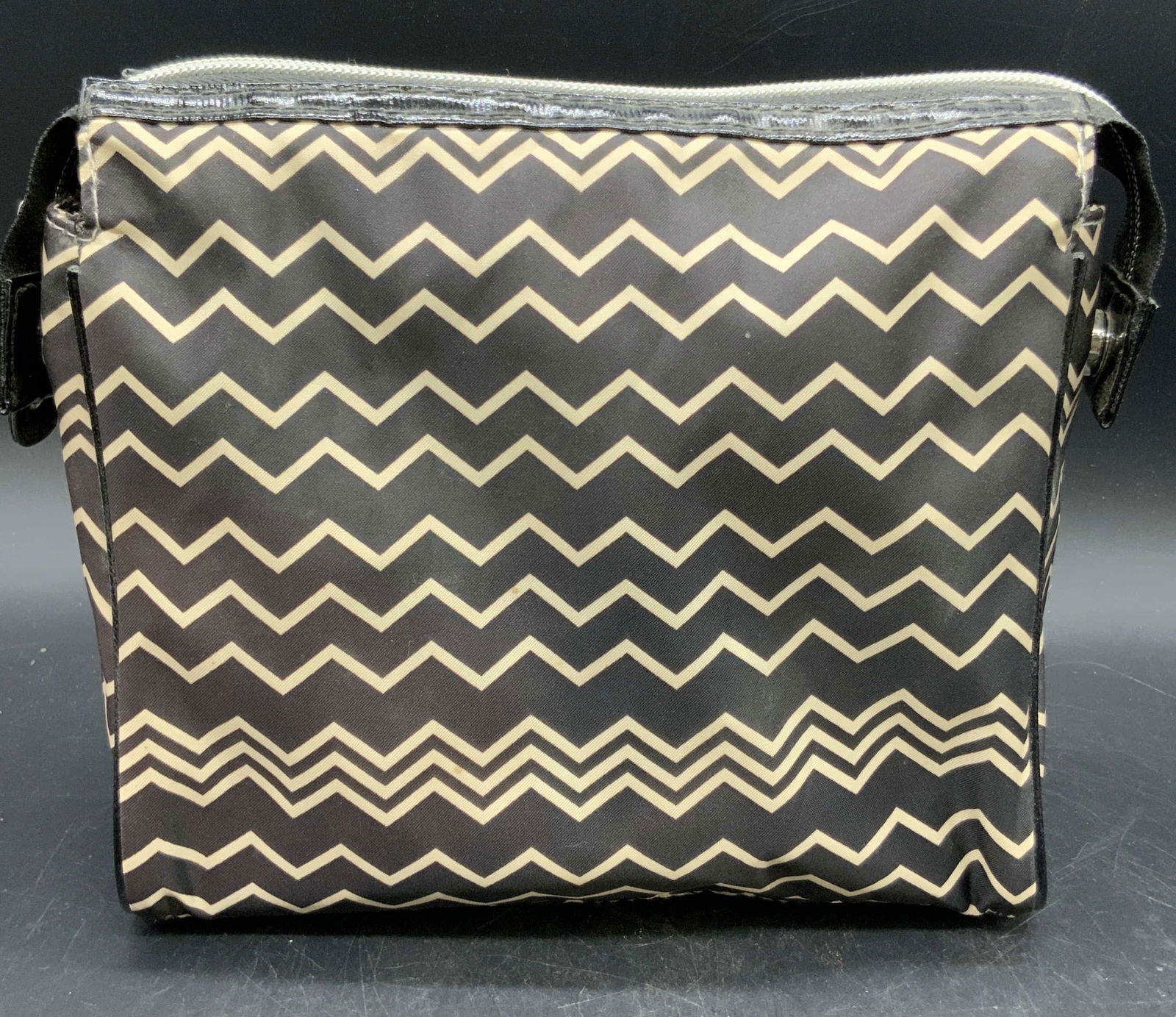 MISSONI Target Zigzag Pattern Cosmetics Bag: A MISSONI for TARGET zigzag patterned cosmetics bag with a zippered closure. Interior tag reads MISSONI TARGET. Material tag reads 100% Polyester. Measures approx. 3.5D x 8W x 7.5L in. Some discolorat