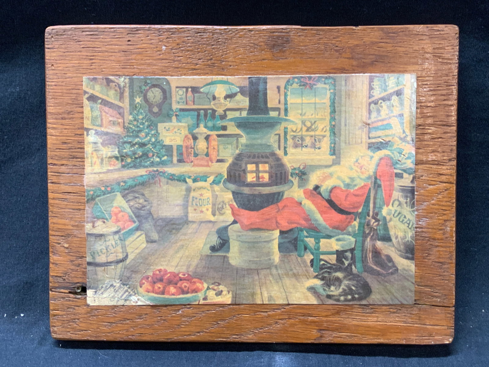 Double Sided Holiday Litho Wooden Wall Panel: Wooden panel with a litho of Santa asleep in a workshop and the other side depicts three red birds made of a woven material affixed to the wood. No frame. Approximately 7.5 x 9.25 inches Evident weari