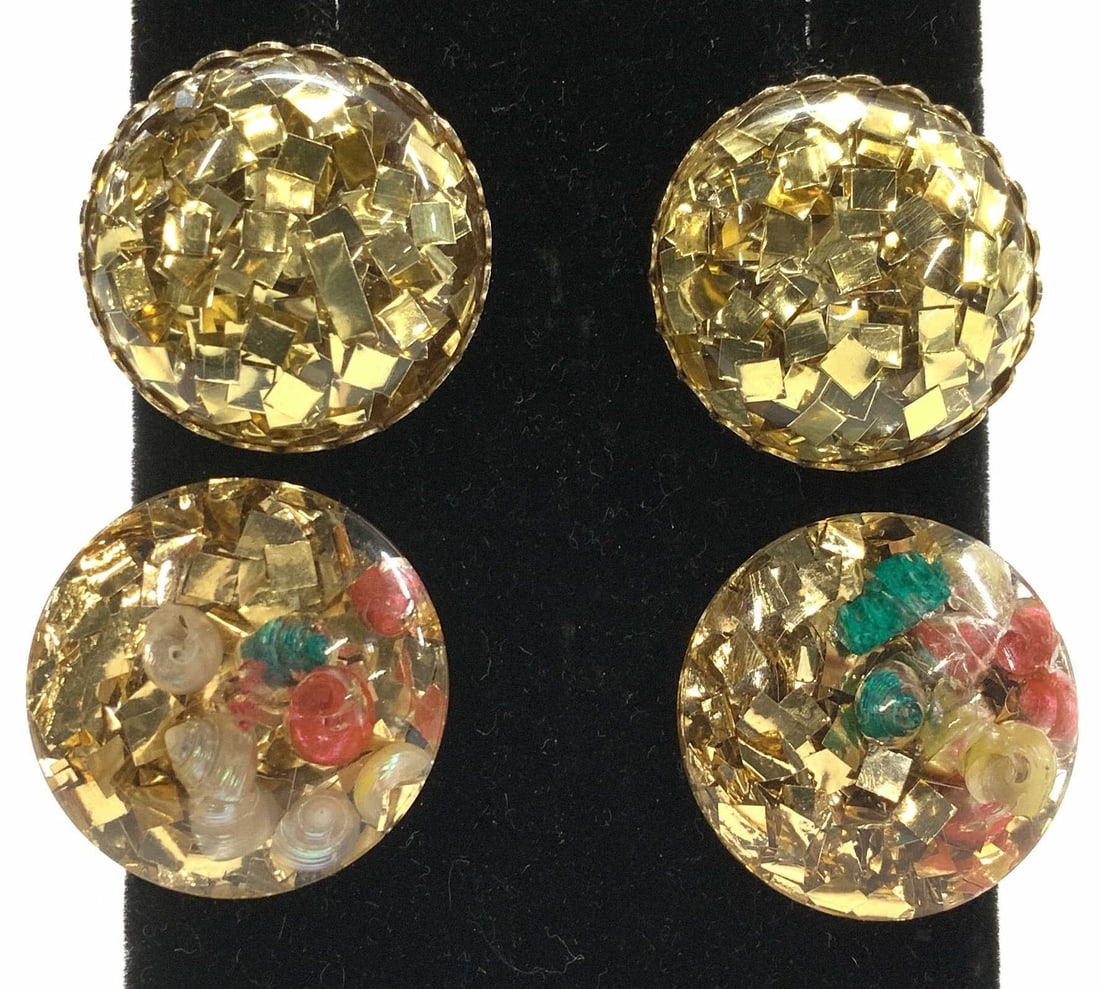 2 Pairs Glittery Clip On Earrings: Resinous Button Clip on earrings with glittery gold party flecks and shells. Measure 1 in. Some wear to resin on on e pair, see picture. Both vintage costume jewelry. Property of Palm Beach Estate Chu