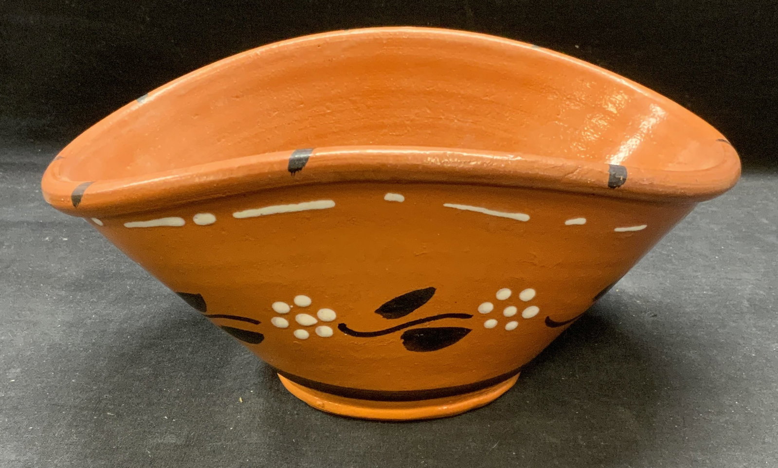 Williams Sonoma Terracotta Bowl, Portugal: Williams Sonoma terracotta bowl with hand painted floral motif. Trademarked to underside. Made in Portugal. Measures approx. 11 x 7.5 x 5 inches. Some minor chipping observed. Williams Sonoma, William