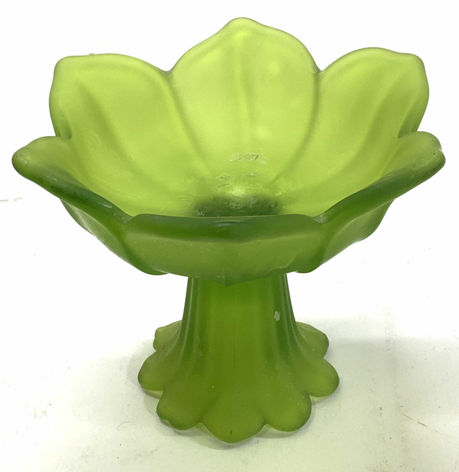 WESTMORELAND Asian Lotus Frosted Green Glass Tazza: Handmade glass. Westmoreland lotus candle holder. Vintage frosted vibrant freed glass This piece can be used as a candle holder or as footed bowl with many uses. 5 x 4 in. W x Ht. Mild scratches. WEST
