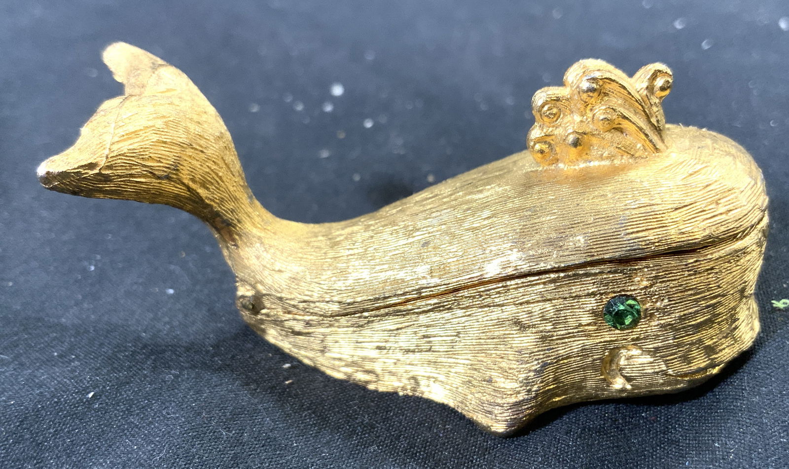 ROSENFELD BY FLORENZA Gilt Metal Whale Pill Box: Interior reads ROSENFELD BY FLORENZA. Pill box is gold toned gilt metal. Box has hinged lid & green toned rhinestone eyes. Piece measures approximately 2.25 inches deep 1 inch tall & deep. Pill box, g