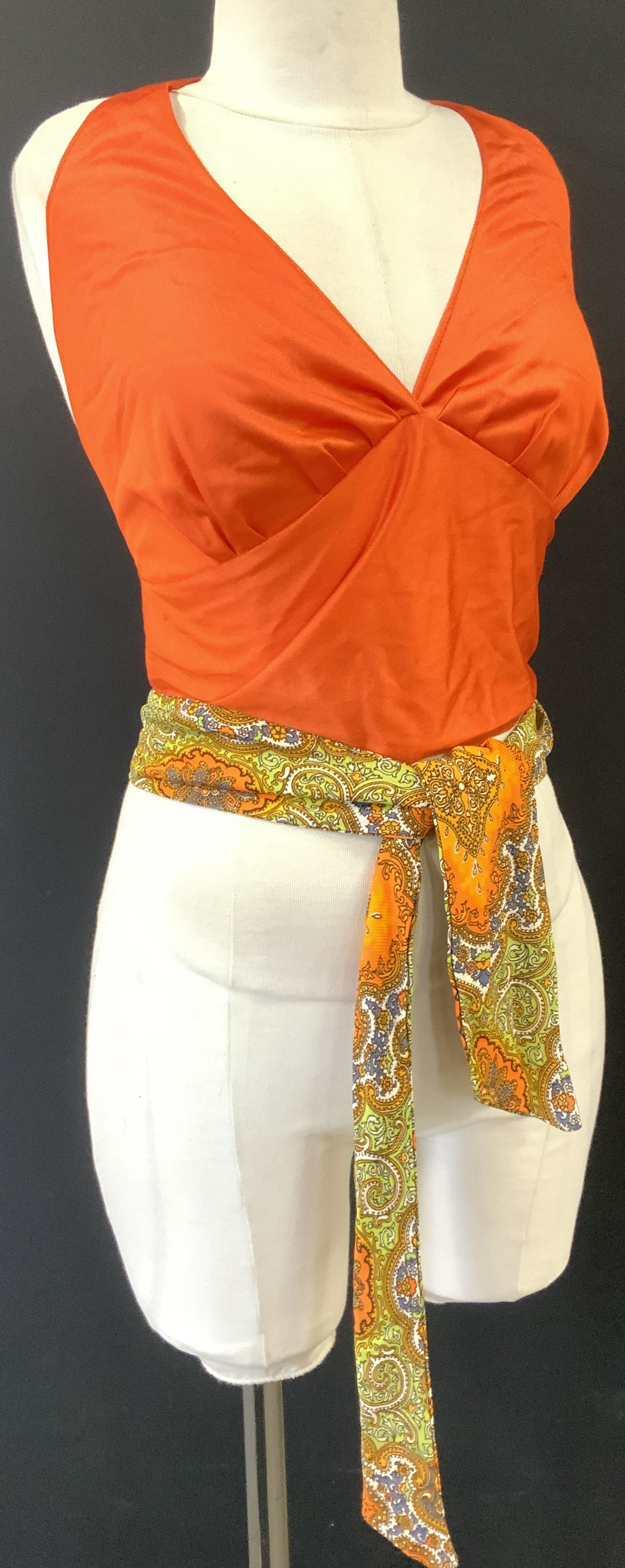 Lot 2 Mid Century Top and Belt: C. 1970s ladies clothing and accessory. Both a soft polyester , one item can be used as a belt, scarf, or head scarf, created into a bag handle, etc. Measures 3 in. Wide x 60 in. Long, thick and doubl