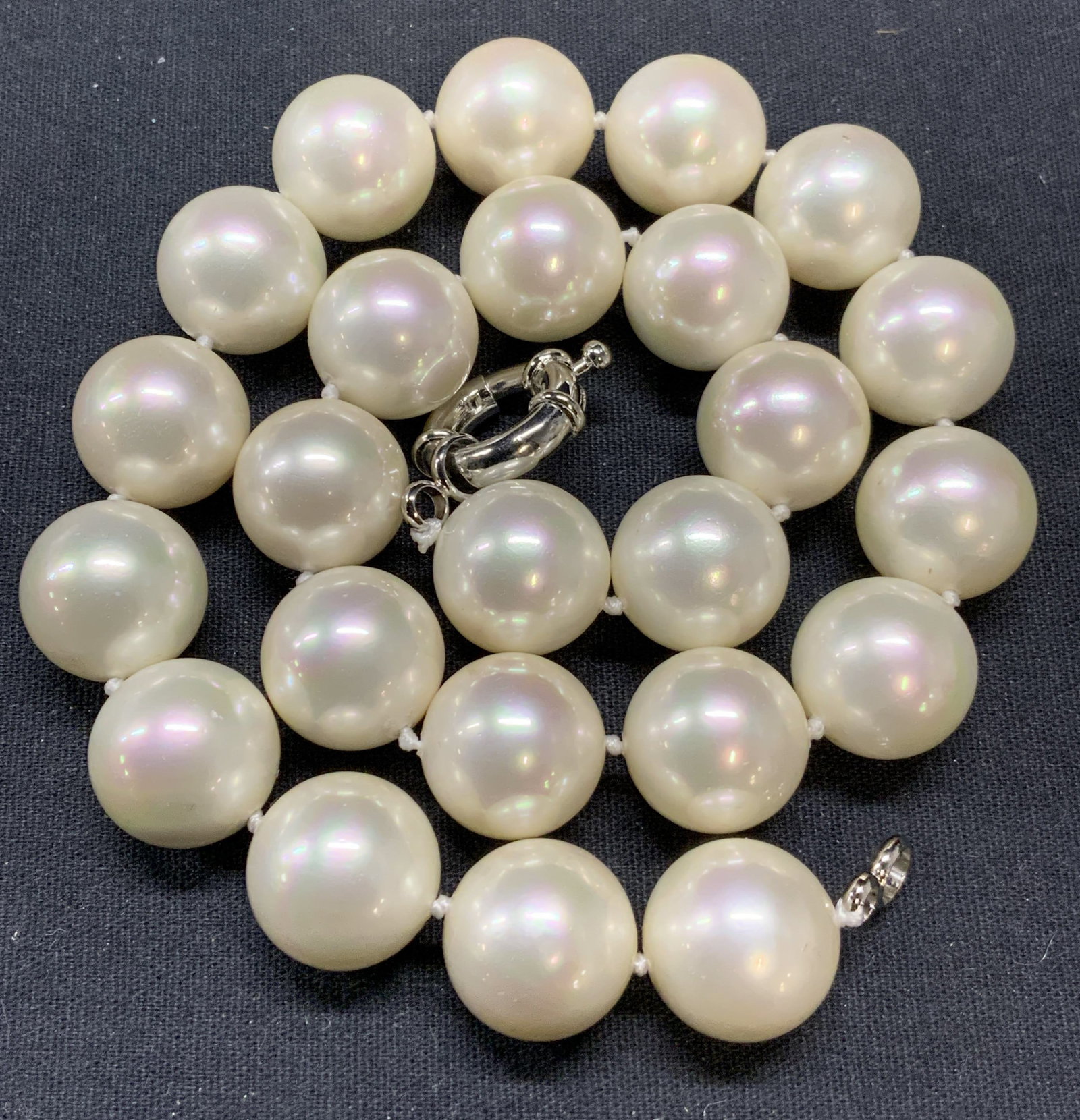 Chunky White Faux Pearl Choker Necklace: Vintage chunky white toned faux pearl necklace on double knotted string. Measures approx. 17 inches long, beads approx. 5/8 inches diameter. Some surface wear including scratching observed. Piece has 