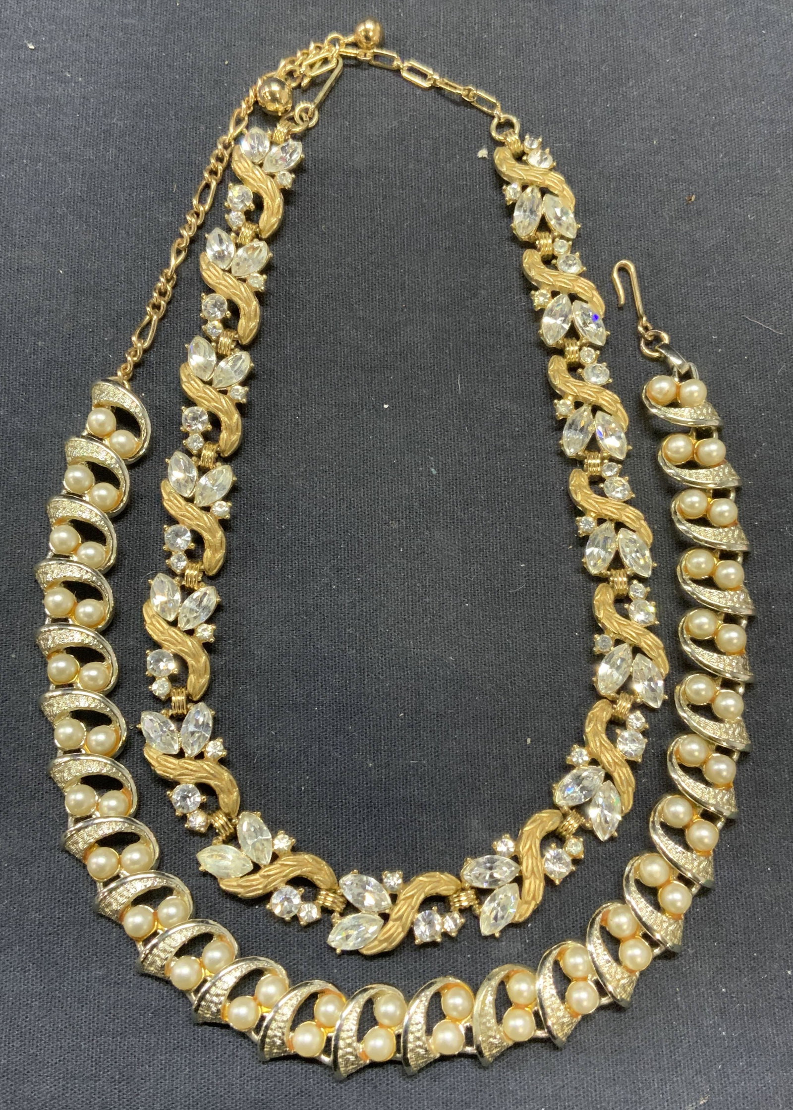 2 Trifari & Marboux Crystal & Faux Pearl Necklaces: Lot of 2 jewelry pieces. Vintage Trifari gold tone and colorless crystal decorated necklace. Signed on clasp. Drop length approx. 6.5 inches. Vintage Marboux silver tone and faux pearl decorated neckl