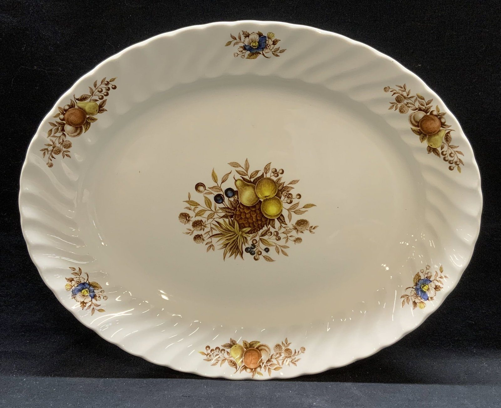 Vintage Swinnertons Desire Fruit Platter, England: Vintage Swinnertons Desire on Royal Wessex white ironstone platter with genuine hand engraving fruit motif. Ribbed textured rim. Made in England. Trademarked to underside. Measures approx. 14 x 11.25 