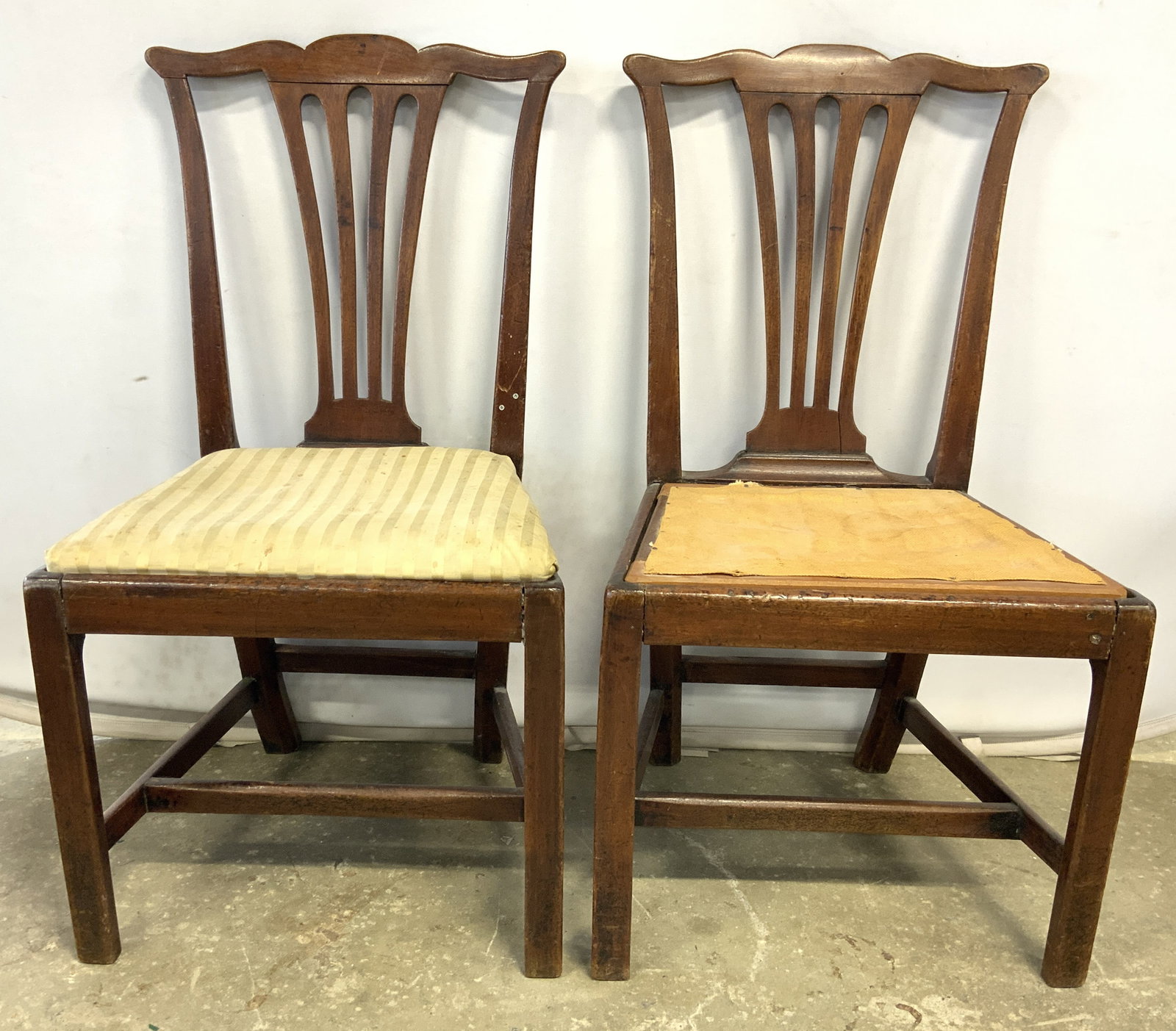 Pair Vintage Chippendale Style Wooden Side Chairs: Lot includes 2 side chairs. Each are vintage and wooden with Chippendale style. Chairs have pierced detail to backrests. Chairs have box stretchers in between legs. Each measures approximately 37 inch