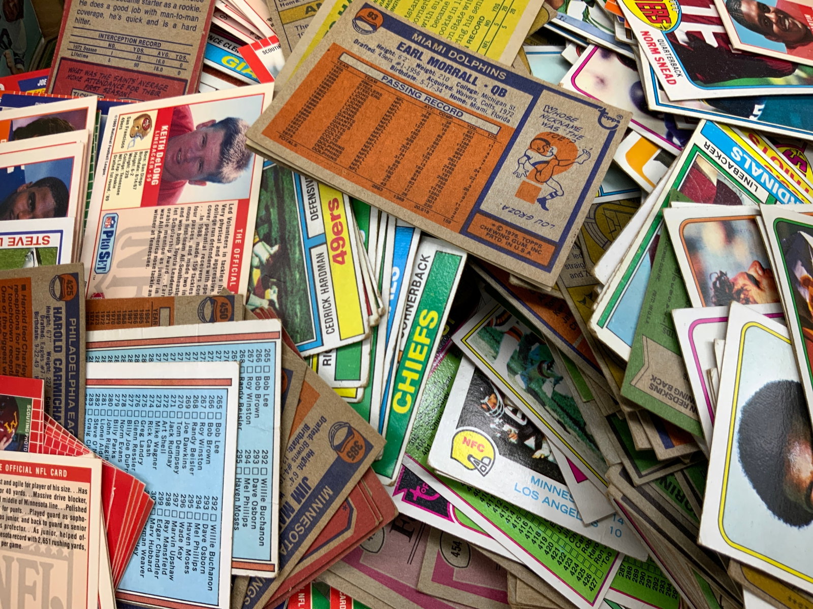 Group Lot Collectible Football Cards, TOPPS & More: A large group lot of collectible football cards, Group has not been researched or sorted. Large collection being sold as found. Brands include TOPPS Chewing Gum, National Football League and TCG. Team