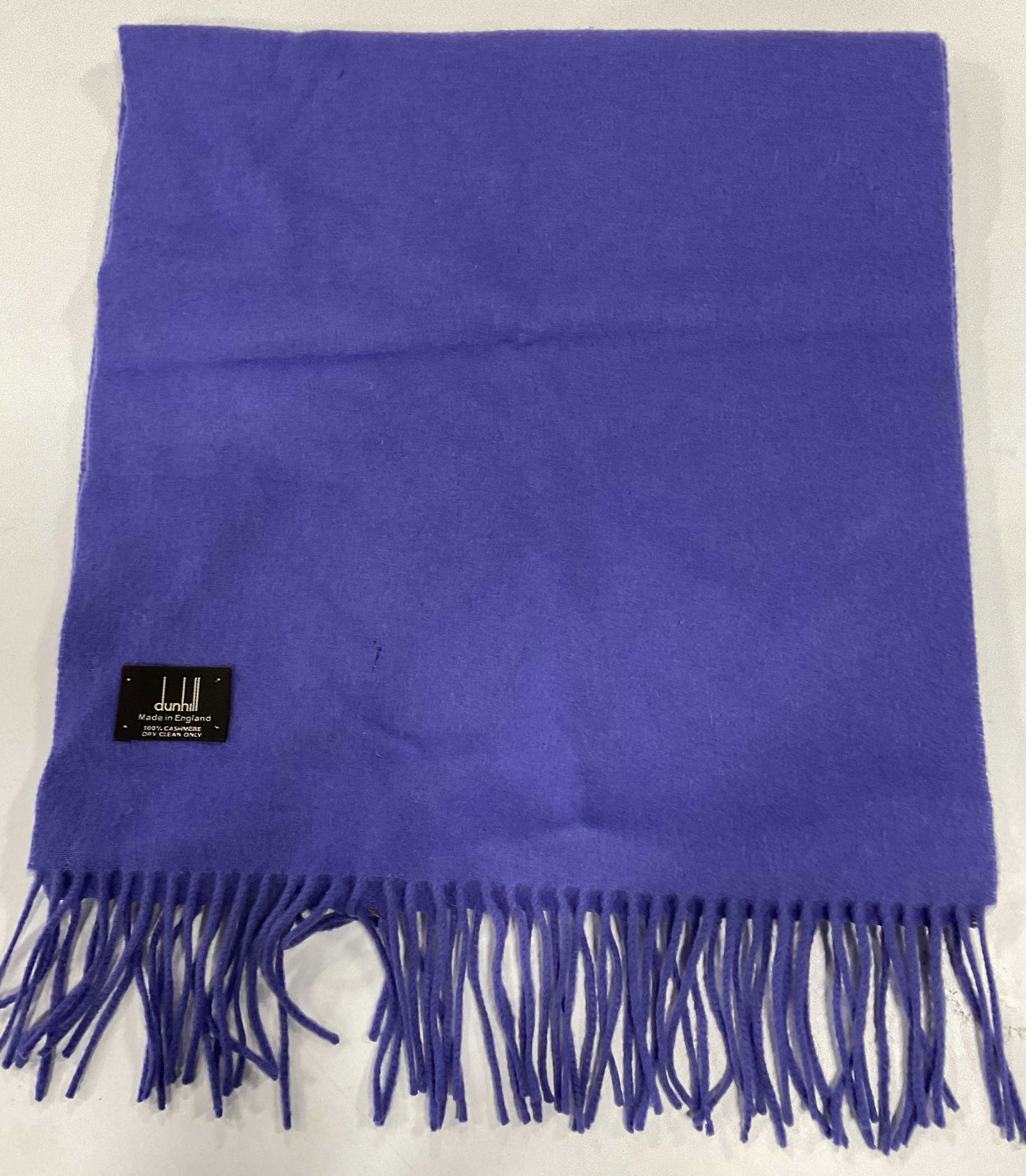 DUNHILL Cashmere Purple Tasseled Scarf, England: DUNHILL Cashmere Purple Tasseled Scarf. Made in England. Measures approx. 62L x 14.5W in. Property of Manhattan estates and fashion industry executive. Some surface wear consistent with age, and use.
