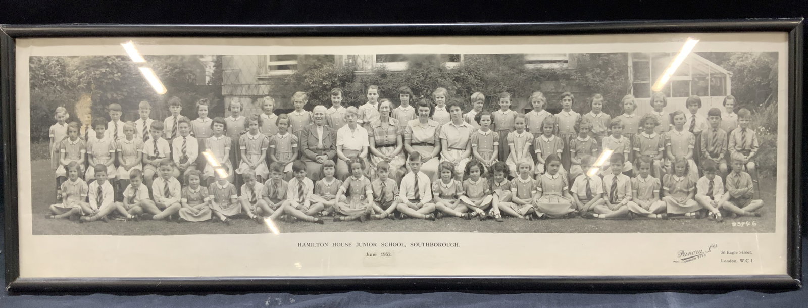 Hamilton House Junior School Class Photo, 1952: Class photograph, in black and white, from Panora ltd. Marked on margin Hamilton house junior school, southborough. June 1952. Depcifs the class with students and teachers. Framed in a black wooden fr