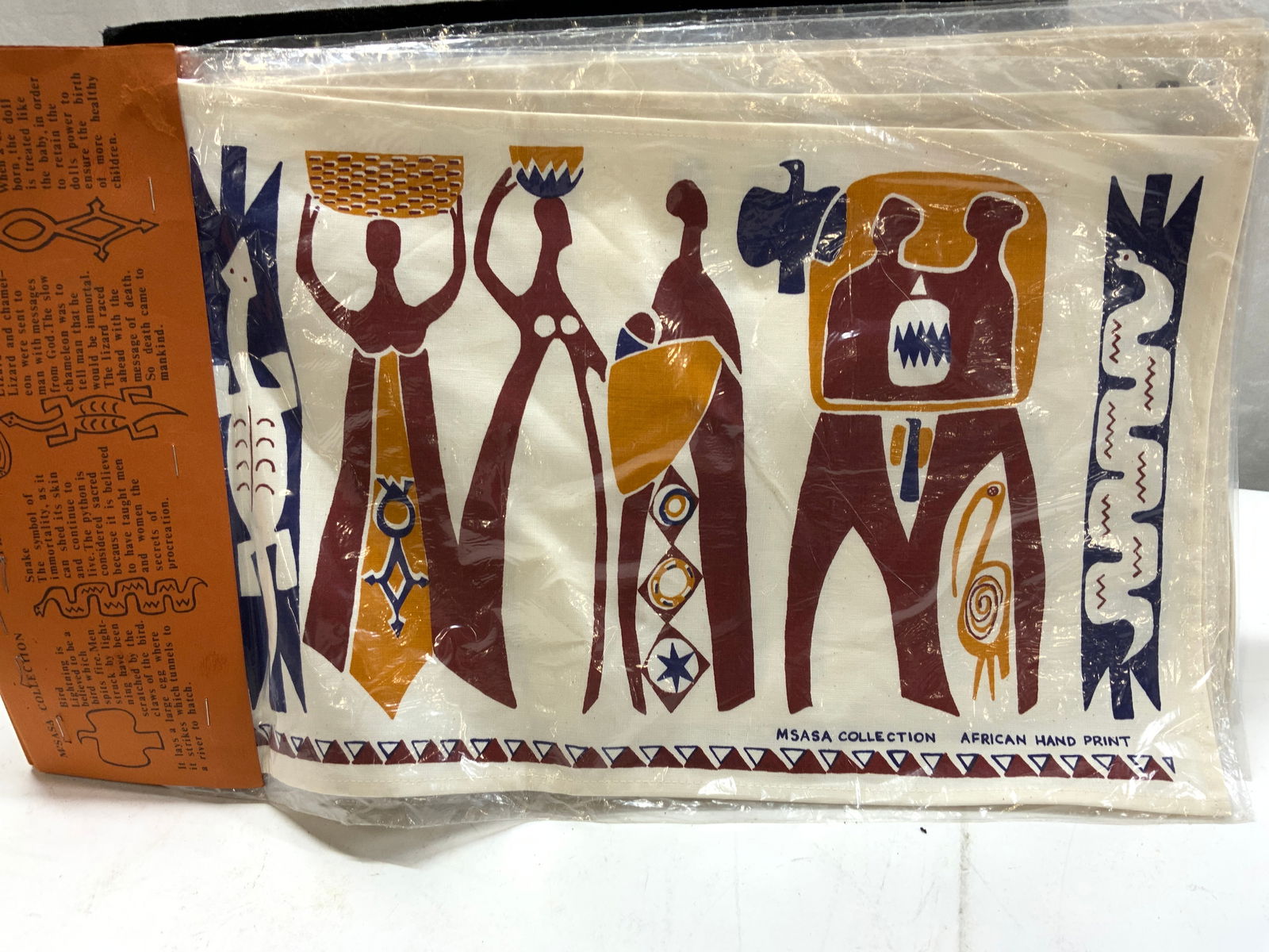 Msasa Collect. African Hand Printed Placemats, NIP: 6 individually wrapped hand printed cotton placemats by Msasa Collection. Primitive African design, high quality art print. Packaging indicates the symbolism of animals in the design. Placemats measur