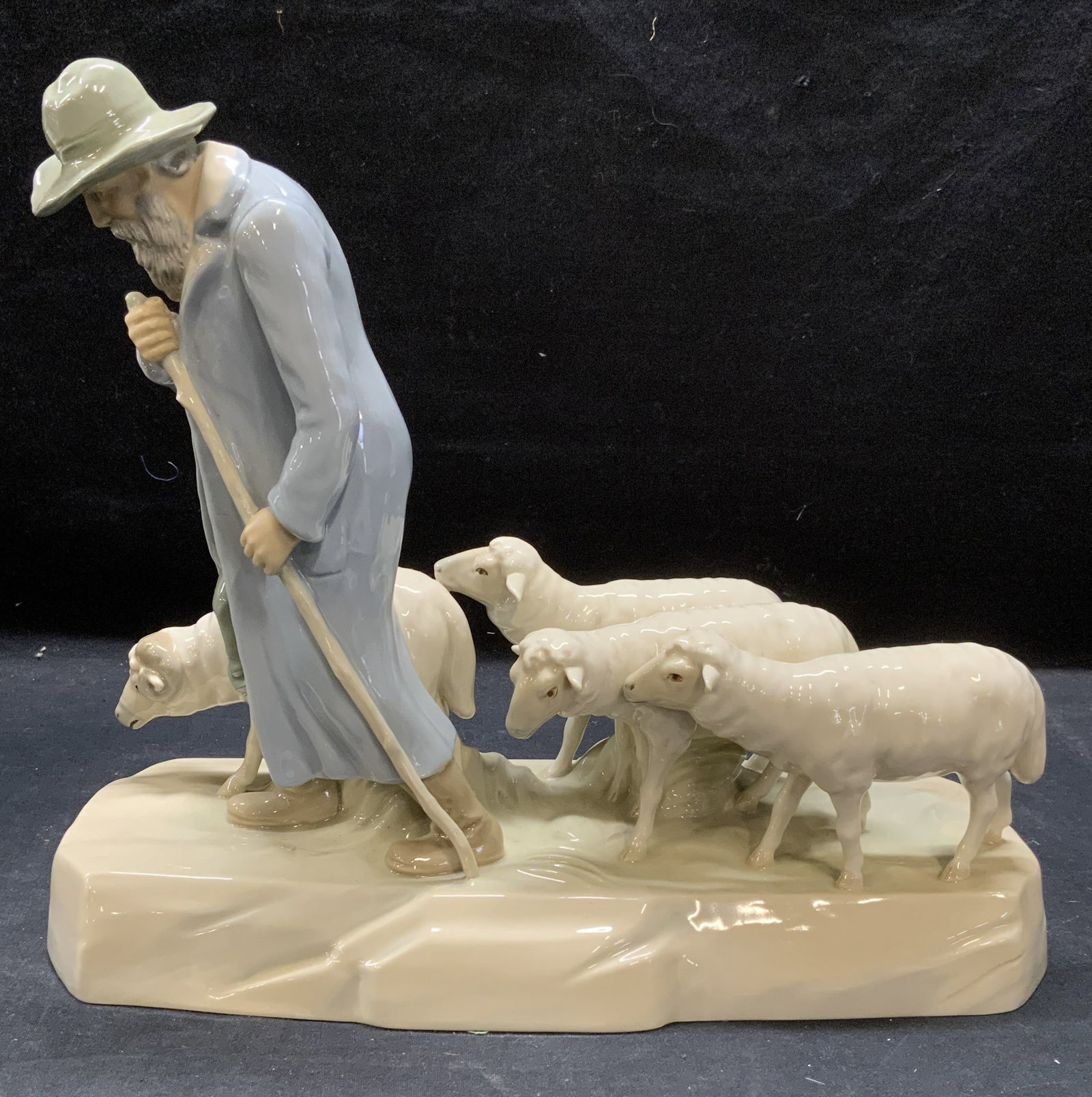 Vntg Royal Dux Bohemia Sheepherder Figural 13in Cz: Vintage Royal Dux Bohemia porcelain sheep herder figural. Hues of blue and white. Trademarked to underside. Made in Czechoslovakia. Artists name on base, Kuhnert. Measures approx. 13 x 5 x 11 inches. 