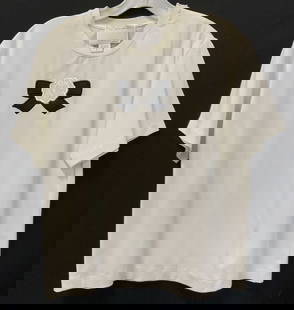 St John Applique White Cotton T Shirt, Italy: This is a St. John White T shirt with a an applique flower and bow in black and white. Zipper along shoulder. Petite medium.23 in. Long. Label reads made in Italy, St. John by Marie gray, St John Spor