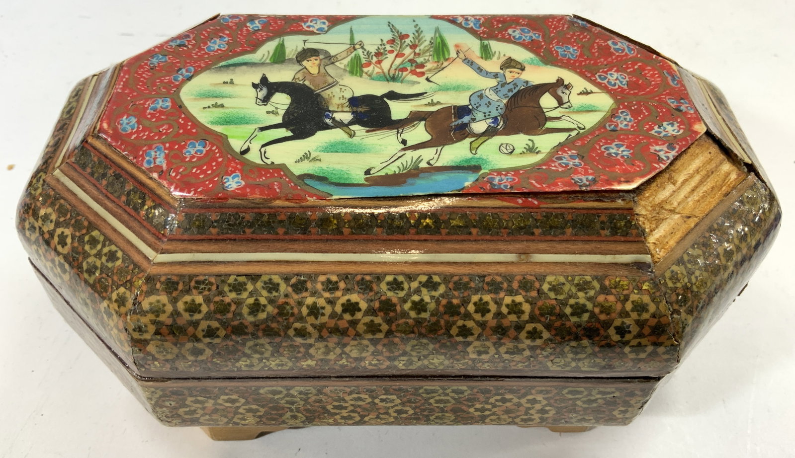 Vintage Wooden Khatam Lidded Persian Jewelry Box: Jewelry box appears to be Khatam (no apparent markings). Jewelry box has hinged lid. Piece intricate geometric detail, lid has landscape scene with figures riding horses. Piece measures approximately 