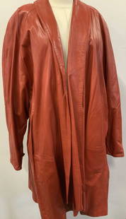 Romeo Gigli Vntg  Leather & Wool Lined Coat, Italy: Butter soft red leather coat by designer Romeo Gigli, made in Italy, labeled a Size 4, should fit a size 6. Open jacket with no closure. Lining is 80% wool, 20% nylon. Drop sleeves, 39 in. Long. Hand