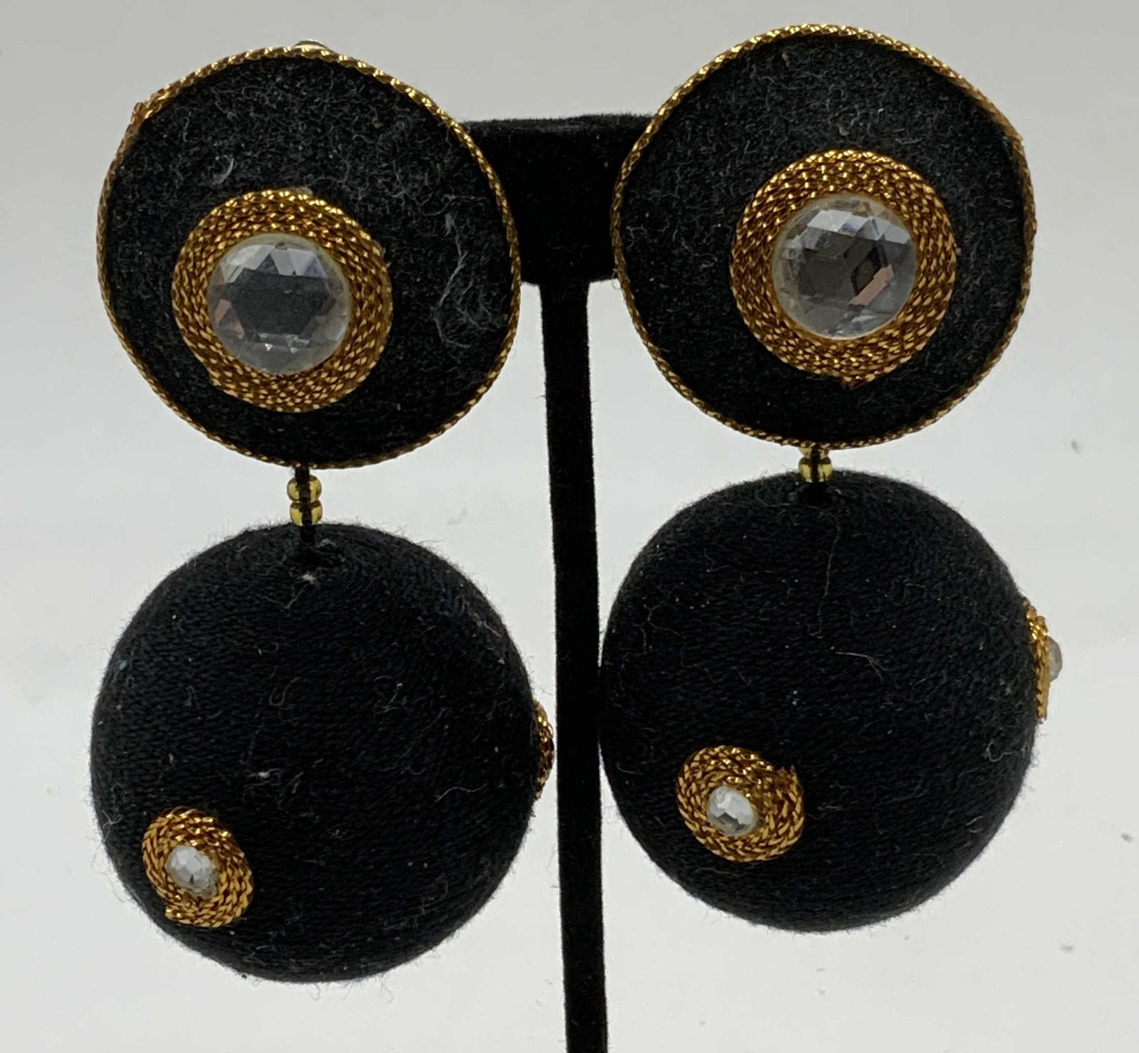Gold Tone & Black Beaded Statement Earrings 3.5in: Gold and black tone fabric covered covered beaded clip on earrings. Measure approx. 3.5 x 1.5 inches. Some wear to material consistent with exposure. Property of Manhattan estates and fashion industry
