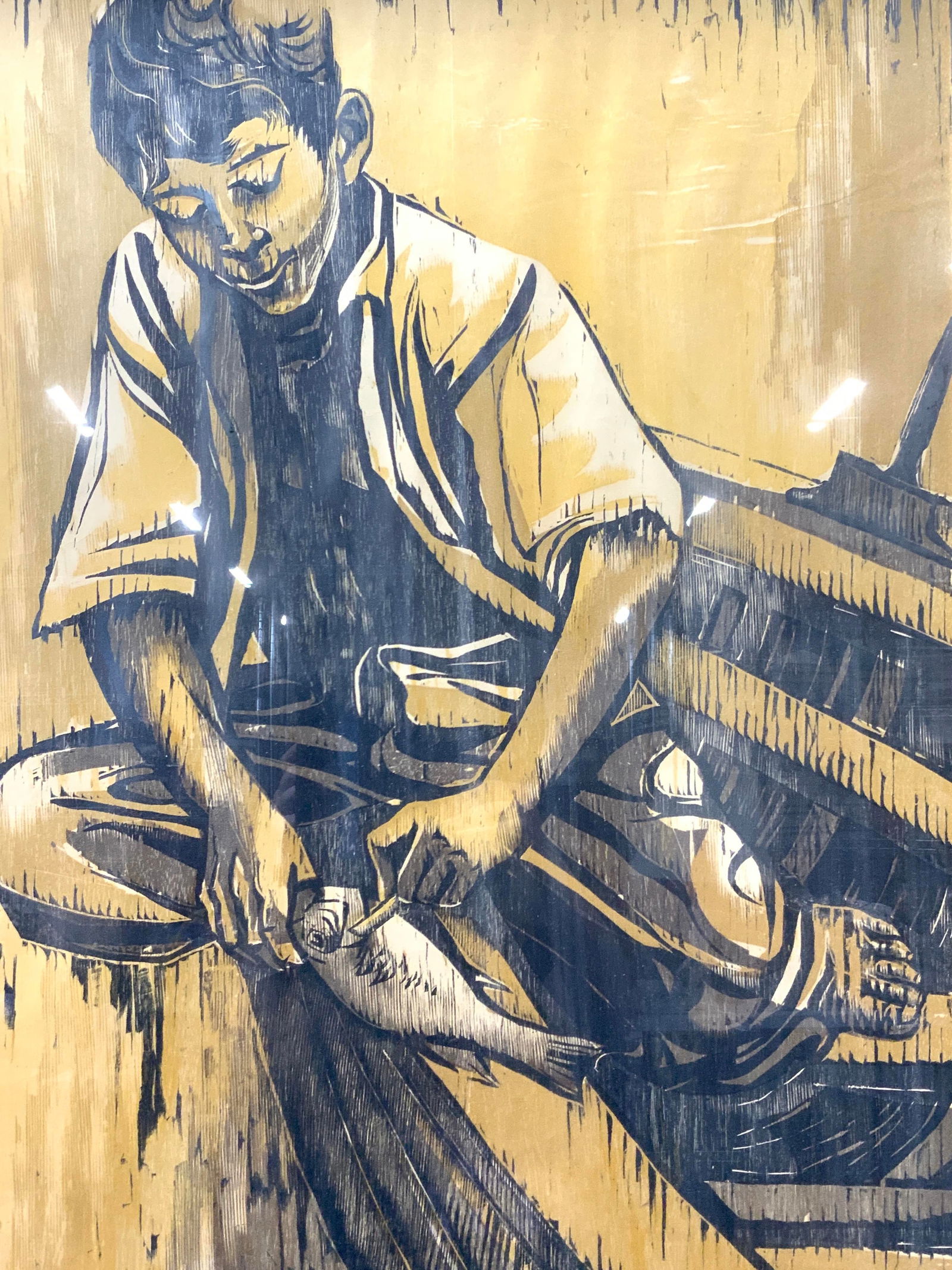 Moshe Gat Signed Wood Cut 1959 3ft3in, Israeli Art: Signed on lower left corner Moshe Gat, possibly reads Mexico, 1959 Depicts a young boy seated in a wooden boat carving a fish in yellow tones. Framed in gold leafed wooden frame. Approx 39 x 25.25 inc