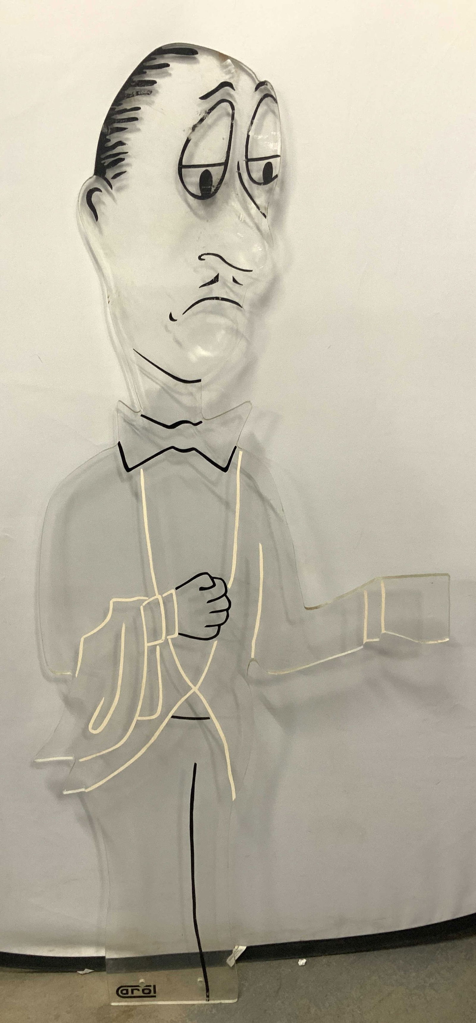 4Ft Carol Lucite Panel Butler Cutout: Part of set of 4. Approximately 4ft tall, a butler figure cut out from lucite with black and white outlines of his suit and black facial features. All features of the butler are decals or paint. Folk