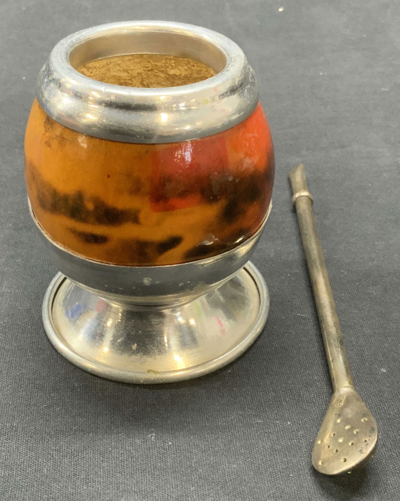 Vintage Yerba Mate Gourd Cup & 800 Silver Straw: Vintage Yerba mate cup. Red and orange toned gourd with silver tone metal rim and foot. Some scratching observed. Vintage .800 silver Yerba mate straw. Trademarked on silver, marked 800. Measures appr