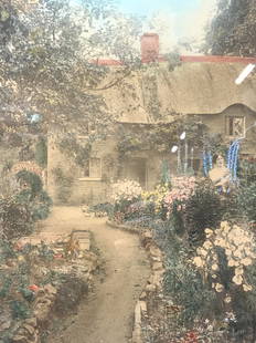 Wallace Nutting Signed Hand Colored Litho: Signed on lower right corner, Wallace Nutting Depicts a cottage with a woman outside in the garden with hand painted elements Framed in a tan toned wooden frame with off white mat board Approx 23 x 19