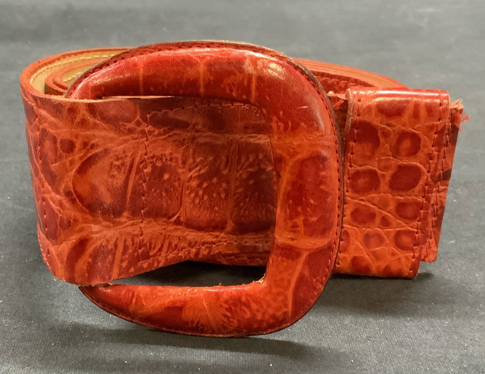 Vintage Lina Lee Red Crocodile Leather Belt: Vintage Lina Lee red crocodile leather belt. Size L. Measures approx. 42 inches long. Designer label to interior. Some wear to leather consistent with exposure. Property of Manhattan estates and fashi