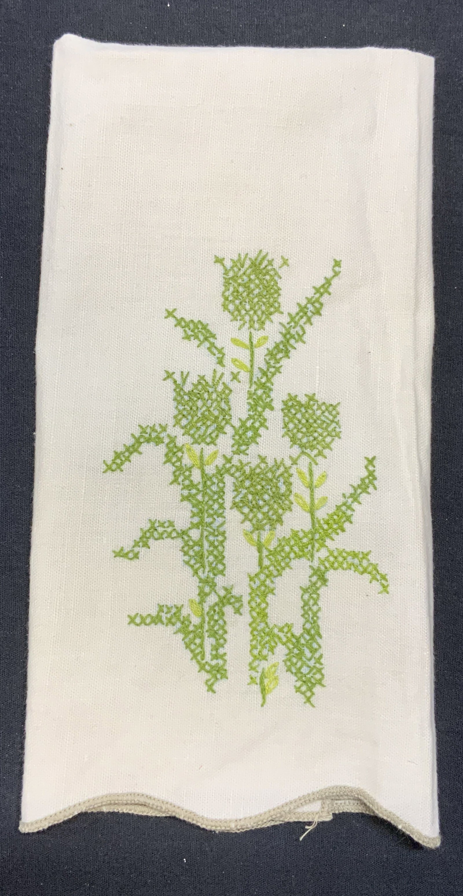 White Cotton Floral Embroidered Tea Towel: White cotton tea towel with floral embroidery. Measures approx. 20.25 x 13 inches. Some wear to material consistent with exposure. Tea towel, white tea towel, floral tea towel, table linens, home deco
