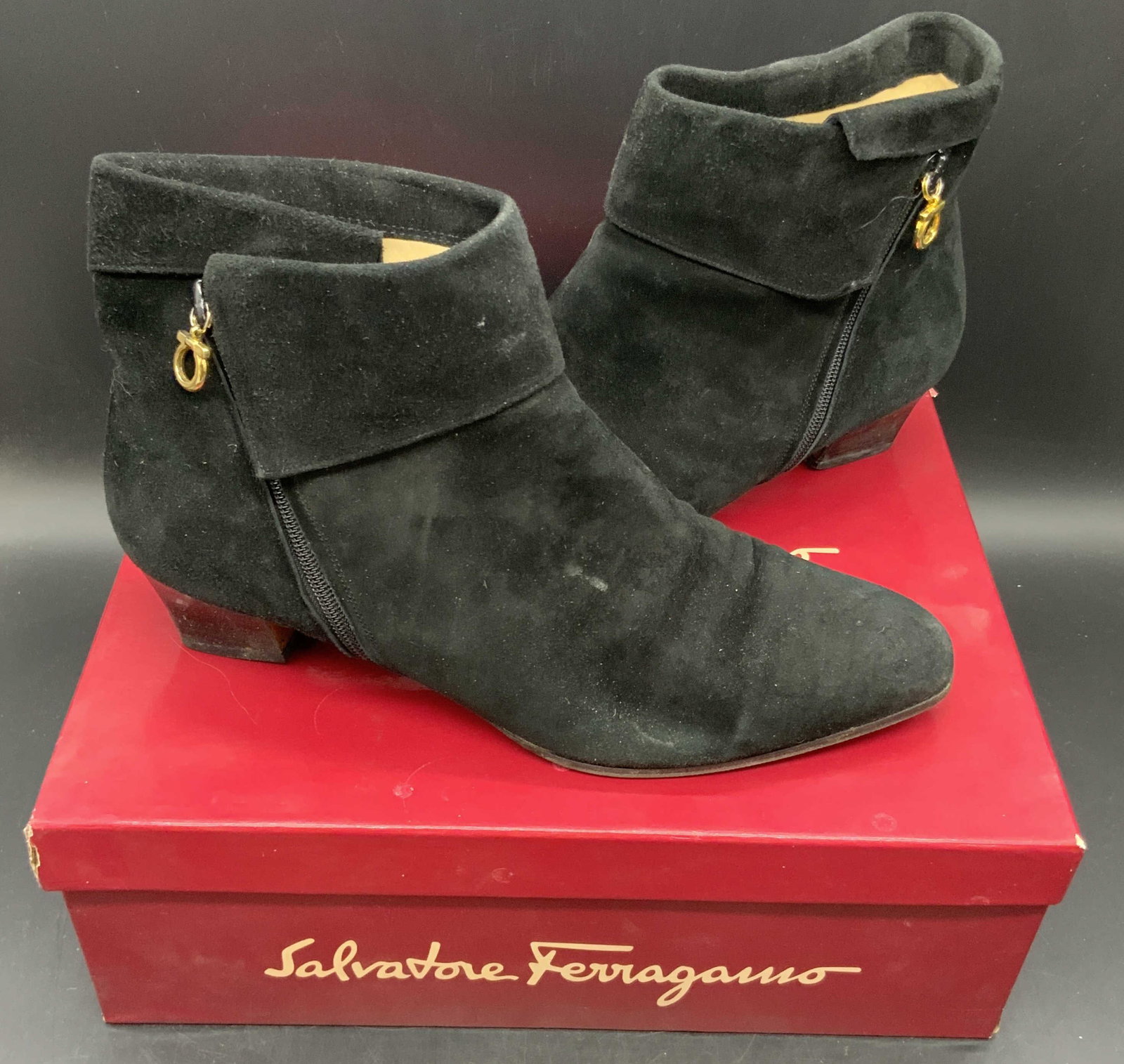 SALVATORE FERRAGAMO Italian Black Ankle Boots, Bx: Vintage SALVATORE FERRAGAMO black suede style fold over heeled ankle boots with gold tone hardware. Boots come in their original red box which reads SALVATORE FERRAGAMO. Size 10. Underside reads 10, M