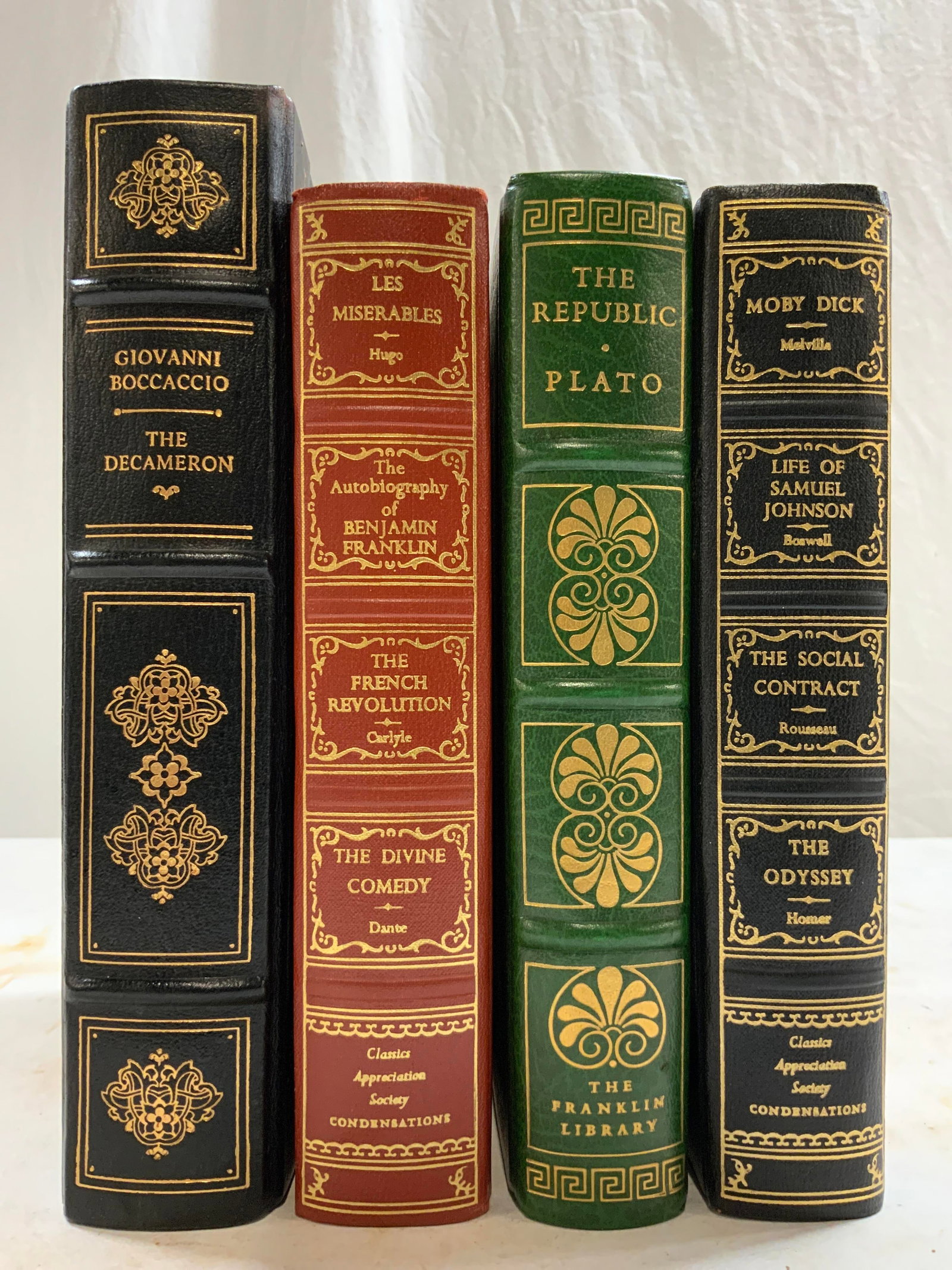 Lot 4 Vintage Leather Books 1955, 1966, 1975: Lot includes 4 books including THE REPUBLIC, PLATO (1975). LES MISERABLES, HUGO, THE AUTOBIOGRAPHY OF BENJAMIN FRANKLIN, THE FRENCH REVOLUTION CARLYLE, THE DIVINE COMEDY DANTE (1955). MOBY DICK, MELVI