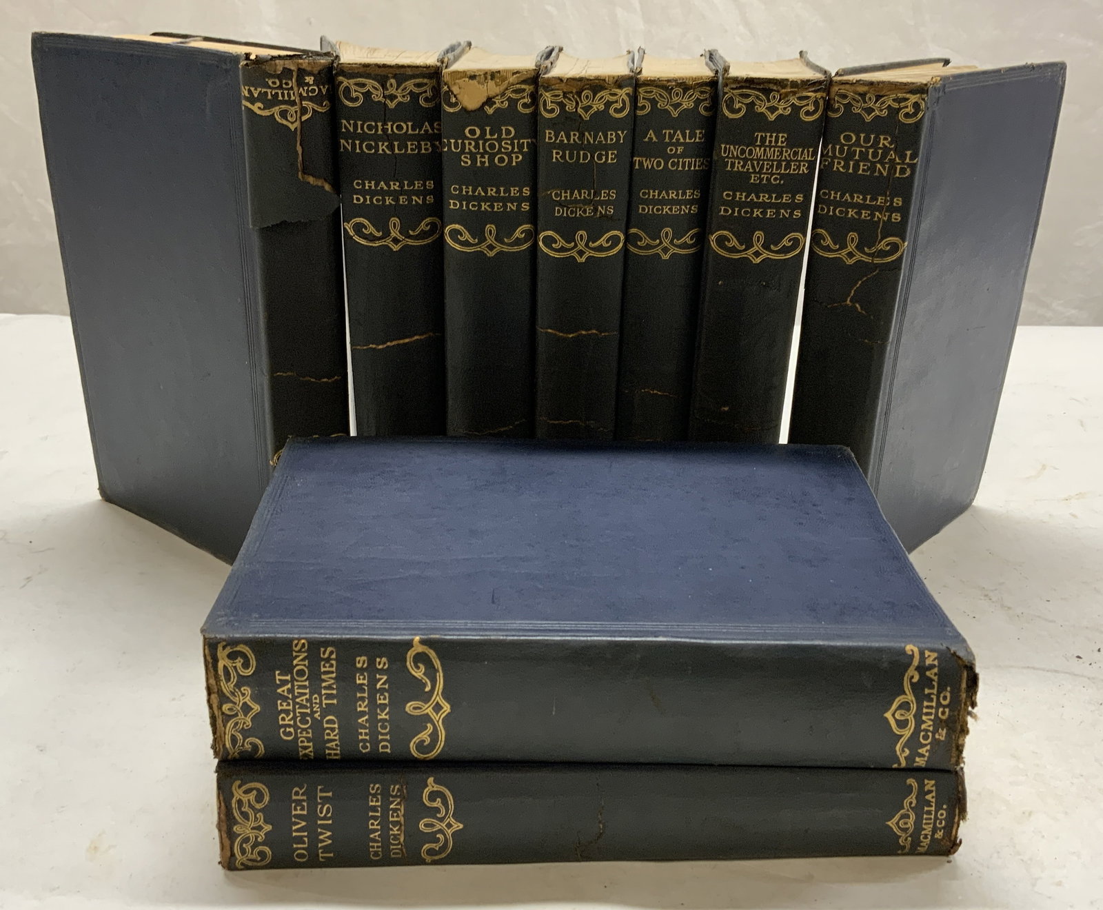MACMILLAN &CO Lot9 Antq Leather Books DICKENS 1927: Lot includes 9 books. Each are navy toned and leather bound with gilt lettering. Books appears to be antique. Includes: Dombry & Son, Nicholas Nickelby, Old Curiosity Shop, Barnaby Rudge, Oliver Twist