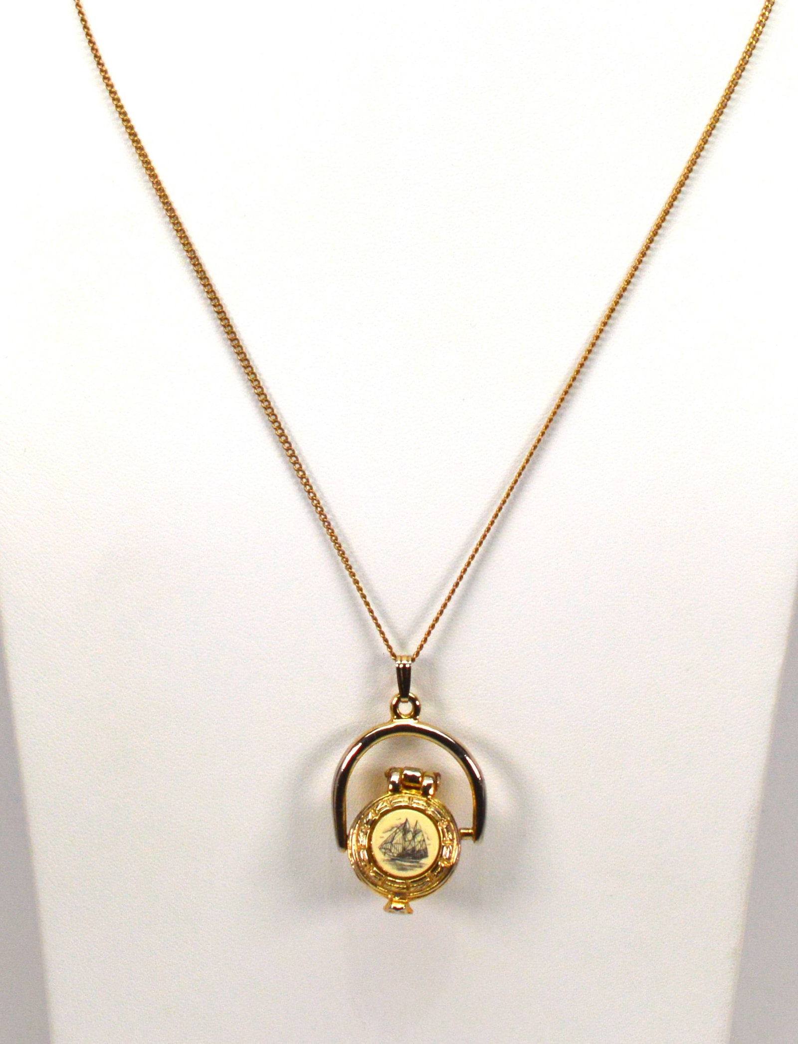 Nantucket Basket Pendant Necklace: Nantucket Basket pewter pendant on a 28 in gold-tone necklace. Scrimshaw sailboat design. NB BS43
