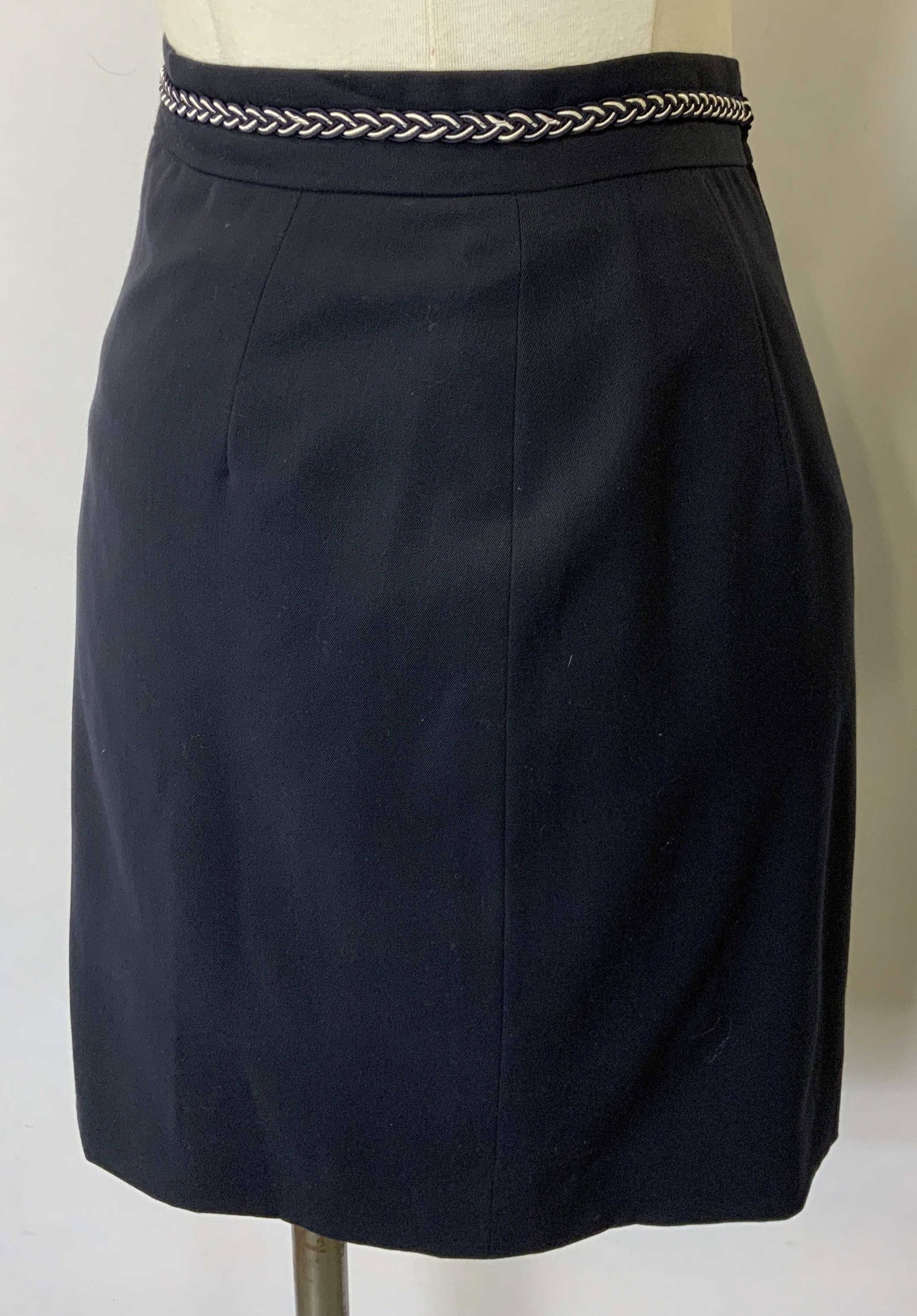 Vtg Les Copains Navy Blue Wool Skirt, Italy: Vintage Les Copains navy blue skirt with braided fabric trim. Size 40. 100% wool. Made in Italy. Some discoloration on trim observed. Les Copains, Les Copains skirt, ladies suit skirt, ladies designer