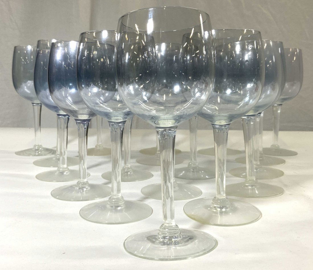 Set 18 Art Glass Goblets Stemware: Lot includes 8 larger & 10 smaller glasses. Each have light blue toned basins with clear stem. Larger glasses measure approximately 6.75 inches tall 3 inches wide. Goblets, Art glass, art glass goblet