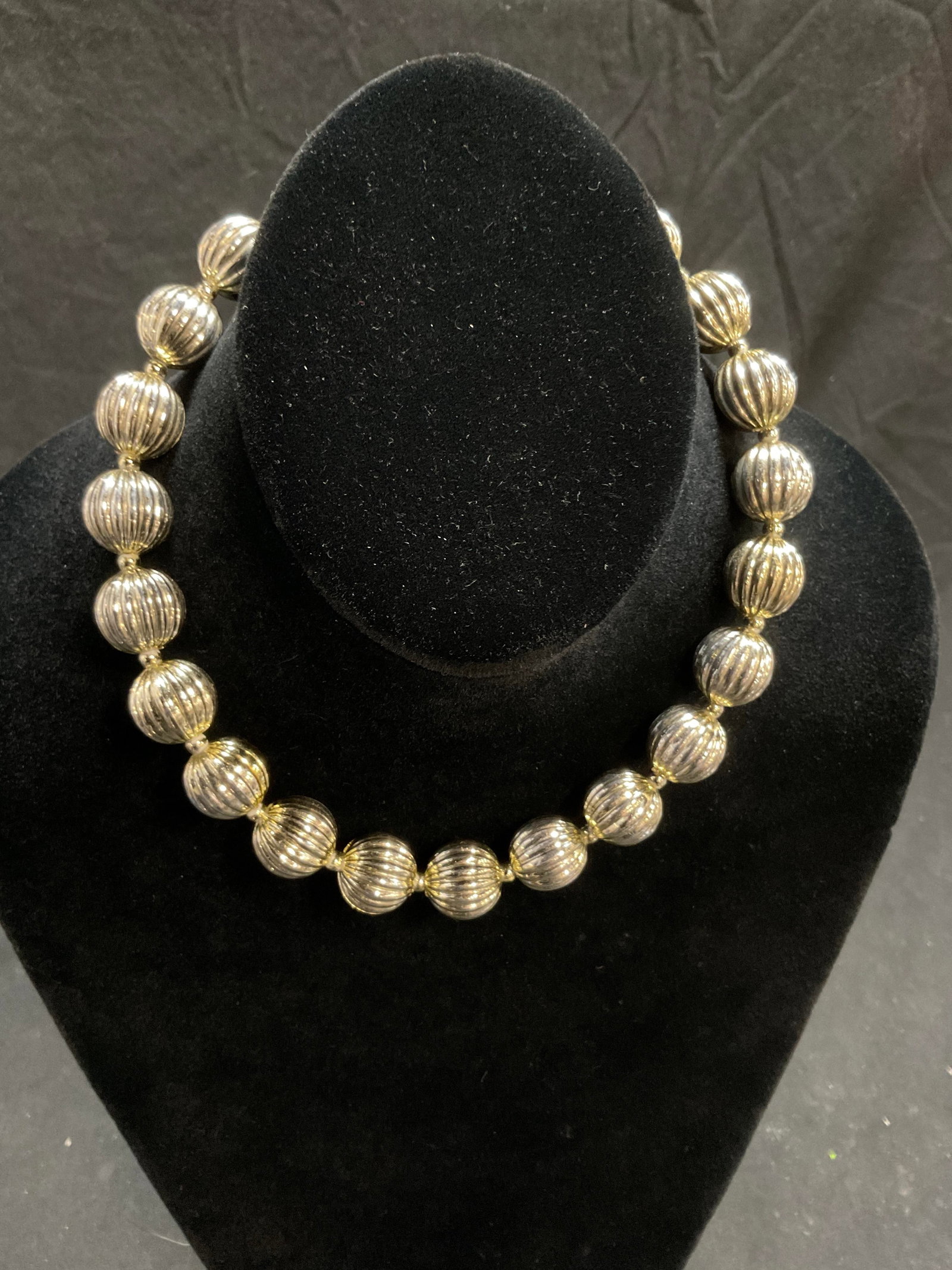 Lot 4 Vintage MOP and Crystal Jewelry: Vintage MOP and Crystal Jewelry. Antique Edelweiss shaped Crystal and faux pearl brooch. 4-Leafed clover crystal brooch. Silver bead choker style necklace. Drop measures approx. 7 in. Carved mother of