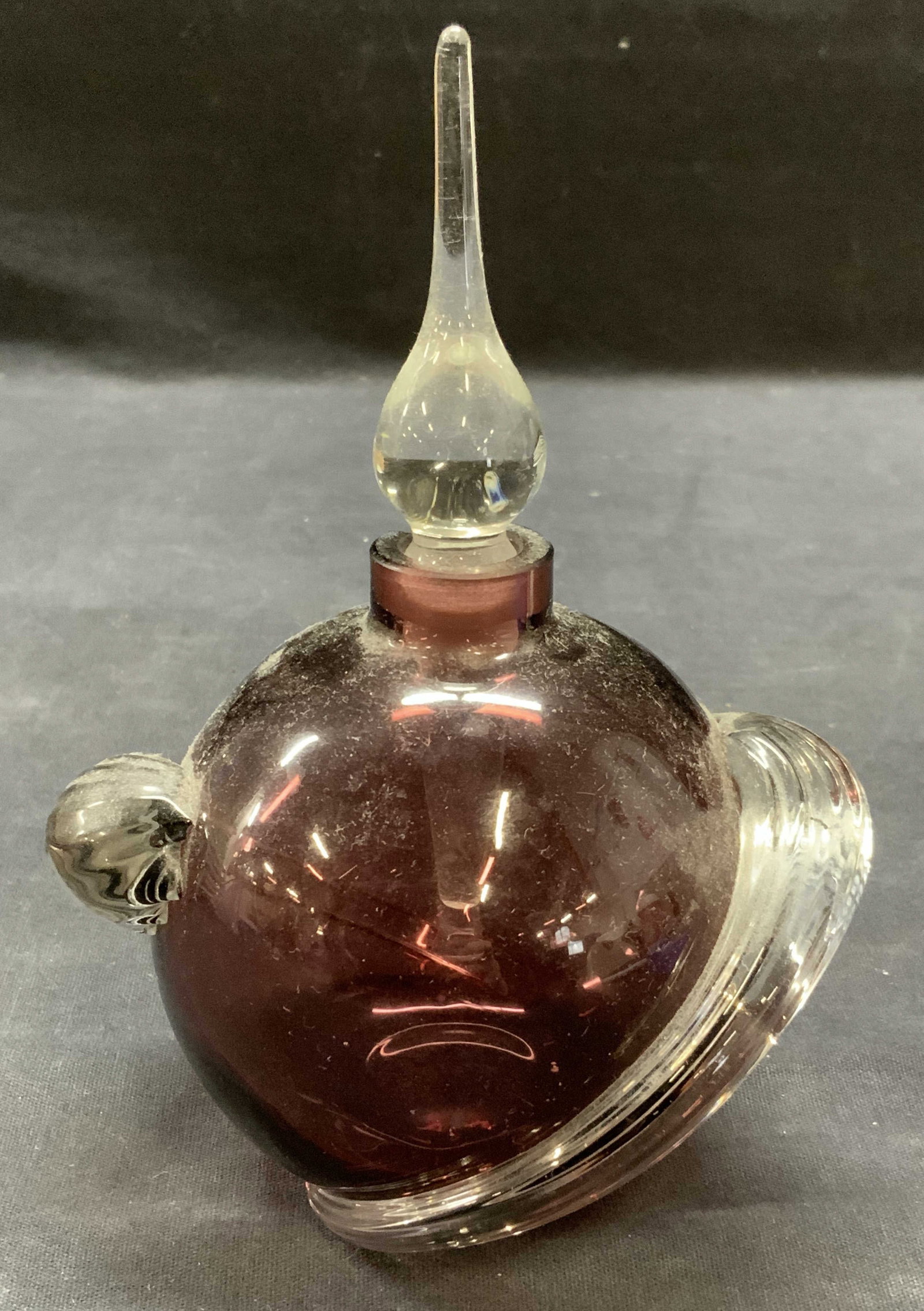 Glass Act Studio Purple Art Glass Perfume Bottle: Vintage Glass Act Studio purple and clear art glass perfume bottle. Trademarked to underside. Made in Taiwan. Measures approx. 4.5 x 6.5 inches. Some surface wear including scratching and chip to rim 
