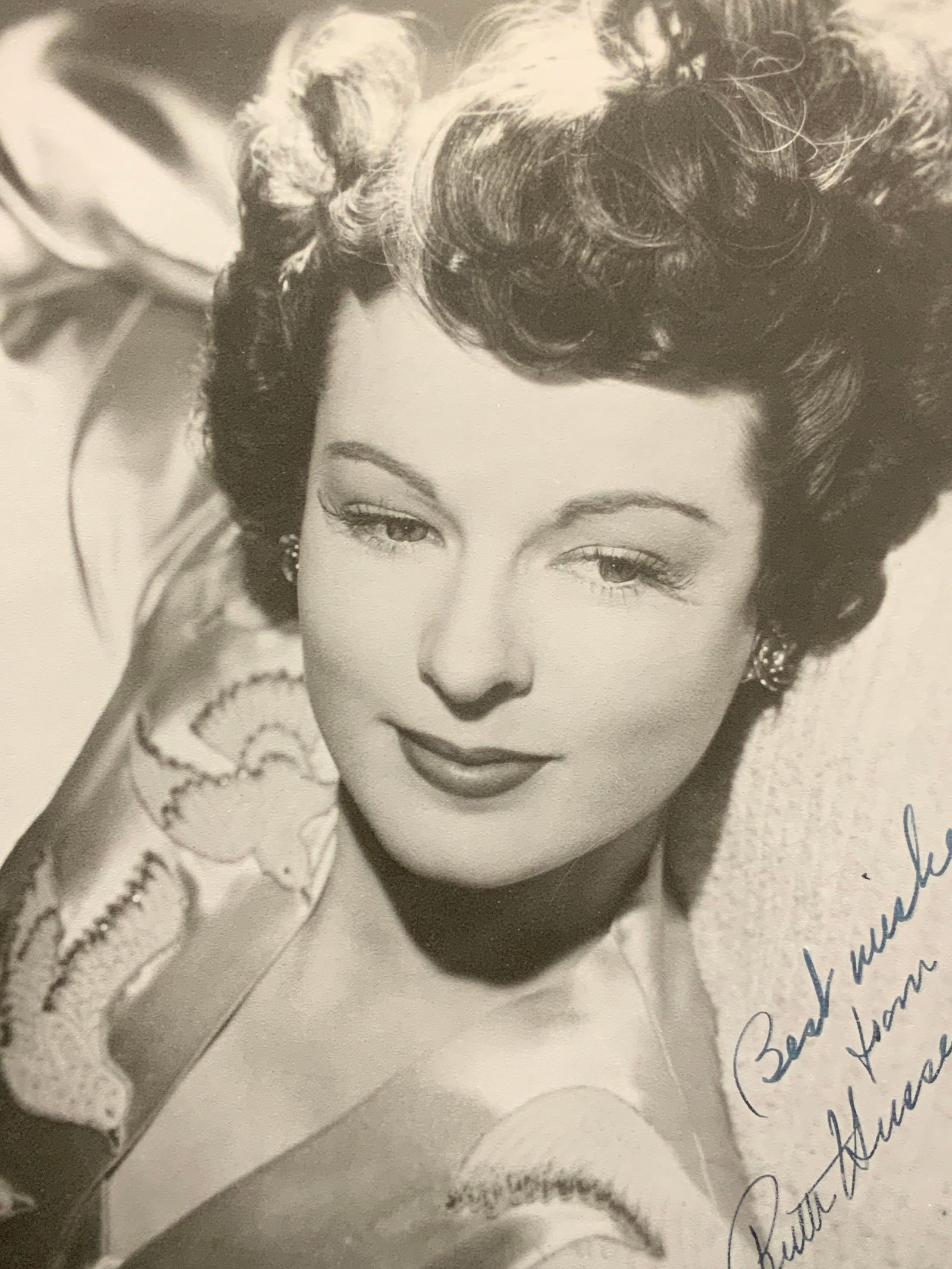 Ruth Hussey Sgd Headshot Lithograph: Marked in lower right corner in blue, best wishes From Ruth Hussey, depicts the actress its her head on a pillow and in an Asian silk robe. Approximately 8 x 10 inches. Moderate wearing to edges of ba