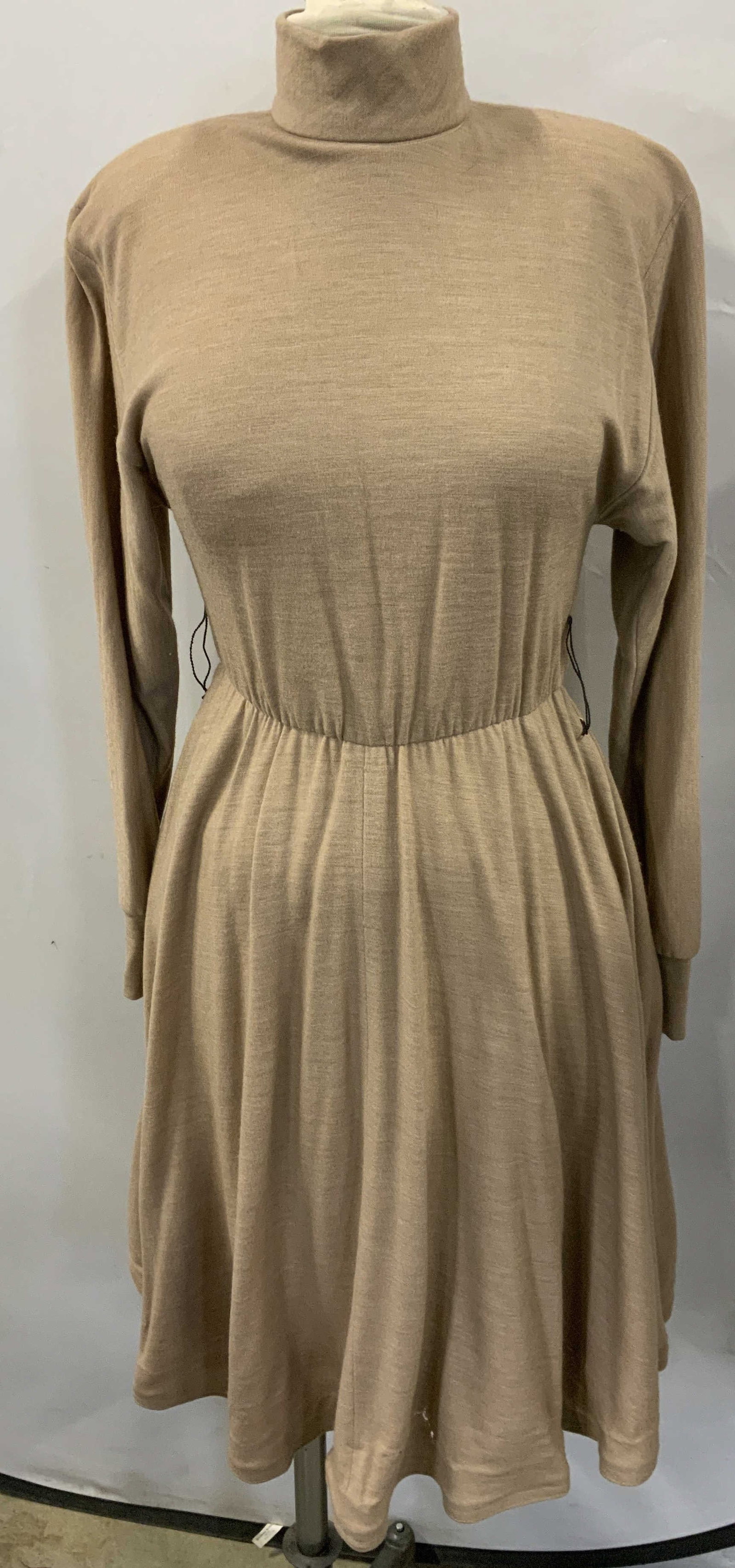 Chetta B Tan Long Sleeve Turtleneck Dress: Chetta B tan long sleeve turtleneck dress. Measures approx. 14.5 inches across chest, 40.5 inches from shoulder to hem. Material feels synthetic. Fabric has stretch. Wear to material including small h