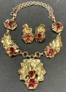 2 MCCLELLAND BARCLAY Sterling Silver Jewelry Set: Lot of 2 jewelry pieces. Vintage McClelland Barclay matching gold plated sterling silver repousse flower pendant necklace and clip on earrings. Red crystal decoration. Art nouveau style. Vintage circa