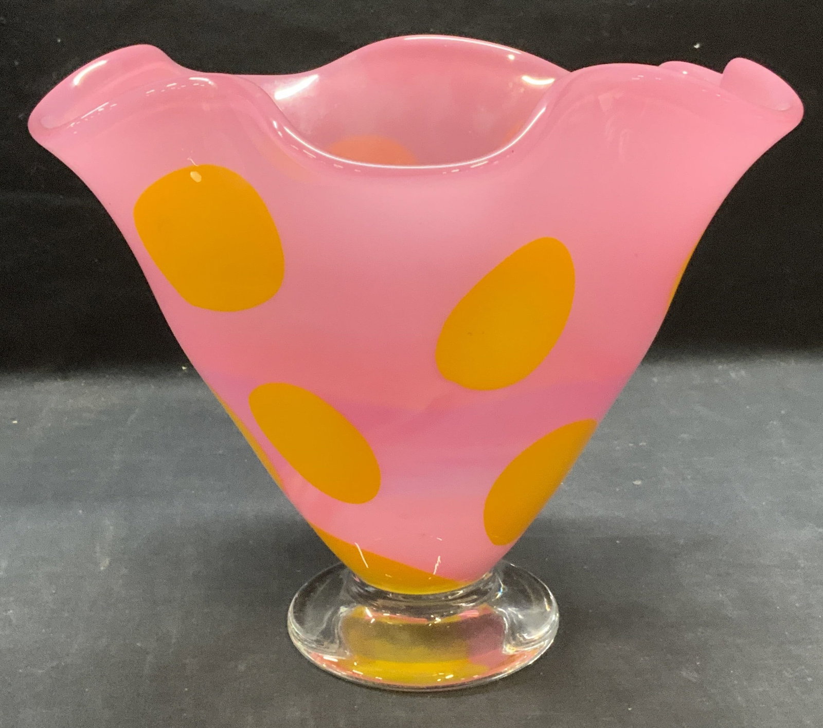 LARSON Pink/Yellow Dot Art Glass Vase: Larson pink and yellow dot pattern art glass vase with clear glass foot and handkerchief rim. Dot has a yellow-orange color shift depending on light. Signed to underside. Thick walled glass, piece has