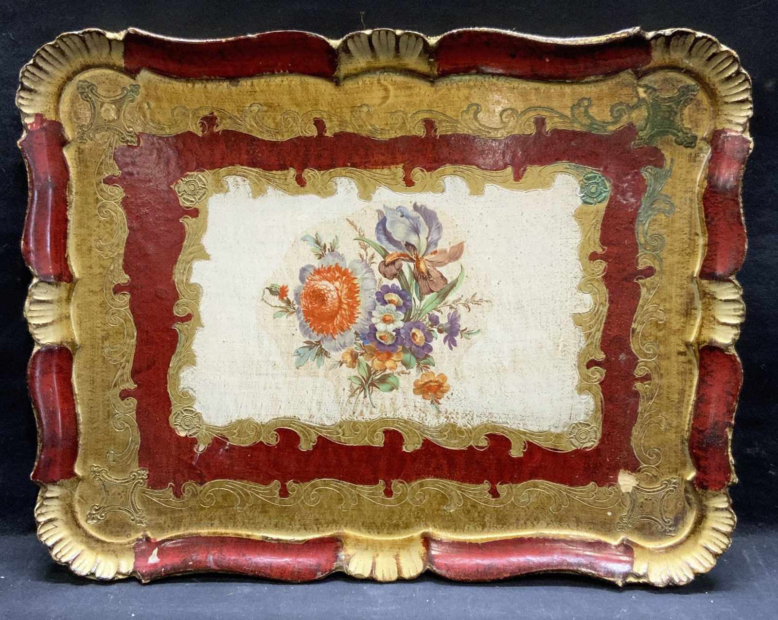 Vintage Lacquered Wood Florentine Tray 16.5in: Vintage, possibly antique, gilt lacquered wood florentine tray. Red and Gilt scalloped border with floral motif to center. Measures approx. 16.5 x 12.5 inches. Some surface wear including scratching a