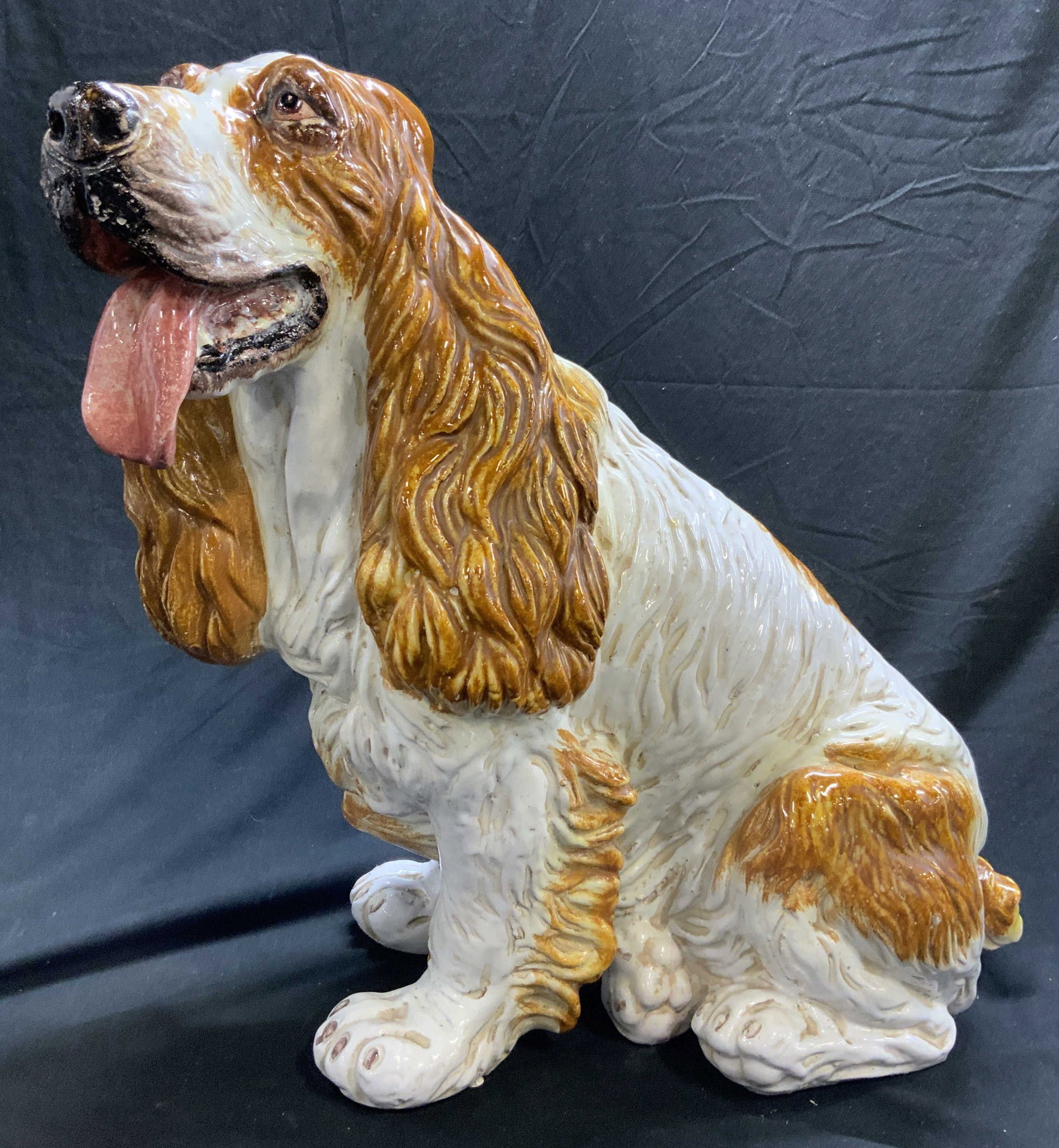 Vintage Italian Glazed Terra Cotta Spaniel 22in: Dog statue is terra cotta. Piece is vintage, depicts a beige and white toned seated spaniel with tongue out. Italian Spaniel sculpture. Measures approx 20 inches tall 22 inches deep 12 inches wide. Te