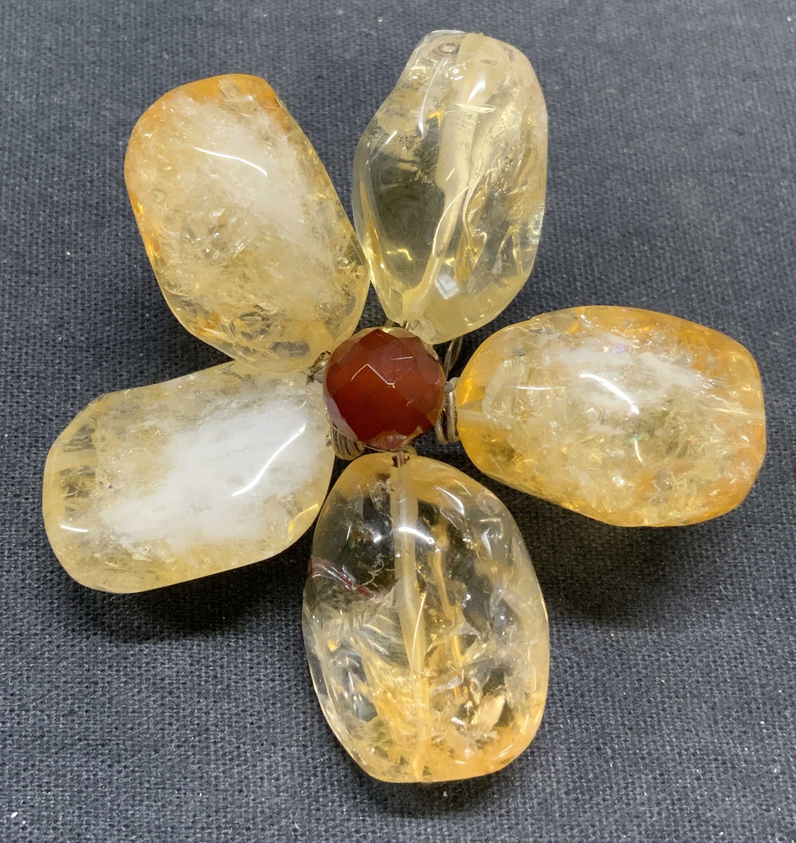 Citrine & Carnelian Gemstone Flower Pendant: Hand crafted citrine and carnelian gemstone flower pendant. Measures approx. 2.5 inches diameter. Largest stone measures approx. 1 inch long. Total weight 242 carats. Some scratching observed. Estate 