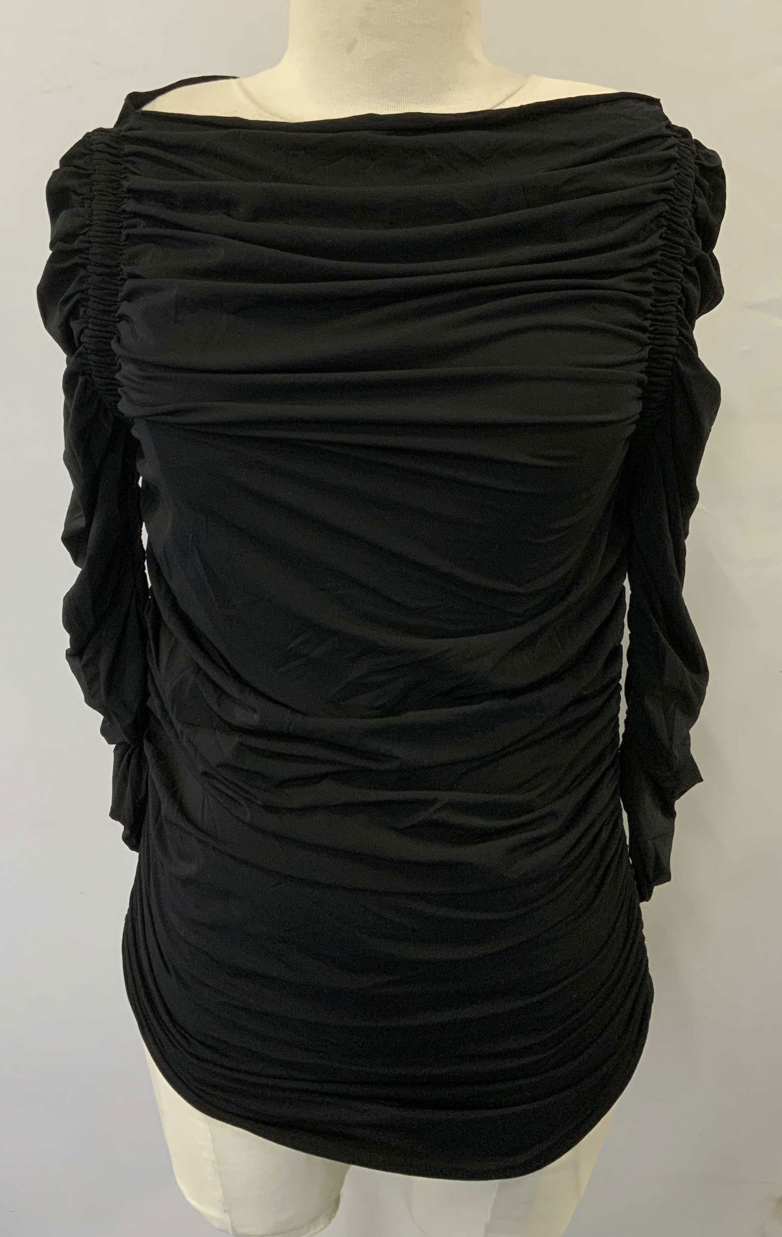 FENDI Ruched Boat Neck Black Top, Italy: FENDI black boat neck long sleeve top with ruches seam detail. Made in Italy. Measures approx. 16 inches across chest. Fabric has stretch. Material feels synthetic. Some blemishes observed. Property o