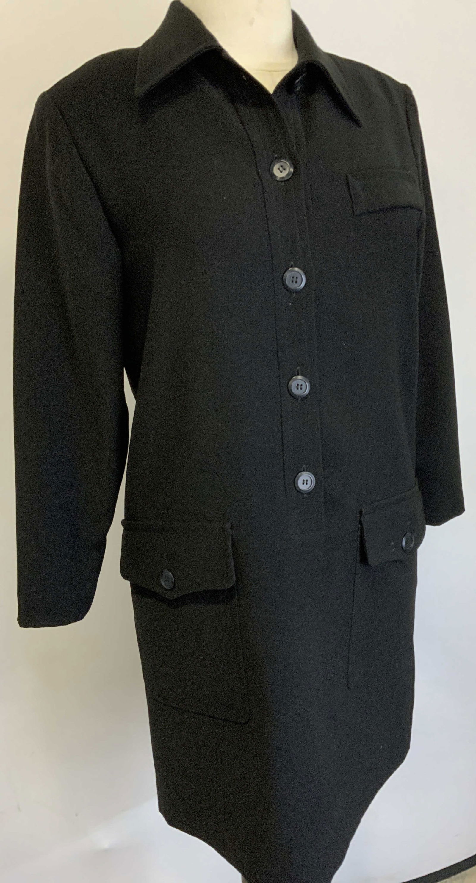 YVES St LAURENT Encore Vintage Black Dress, France: Black Button down YSL encore dress with collar, made in France. Has original label . Vintage / Mid century garment, reads size 38. Ribbed polyester fabric. Has 2 large buttoned pockets, 36-37 in. Wais