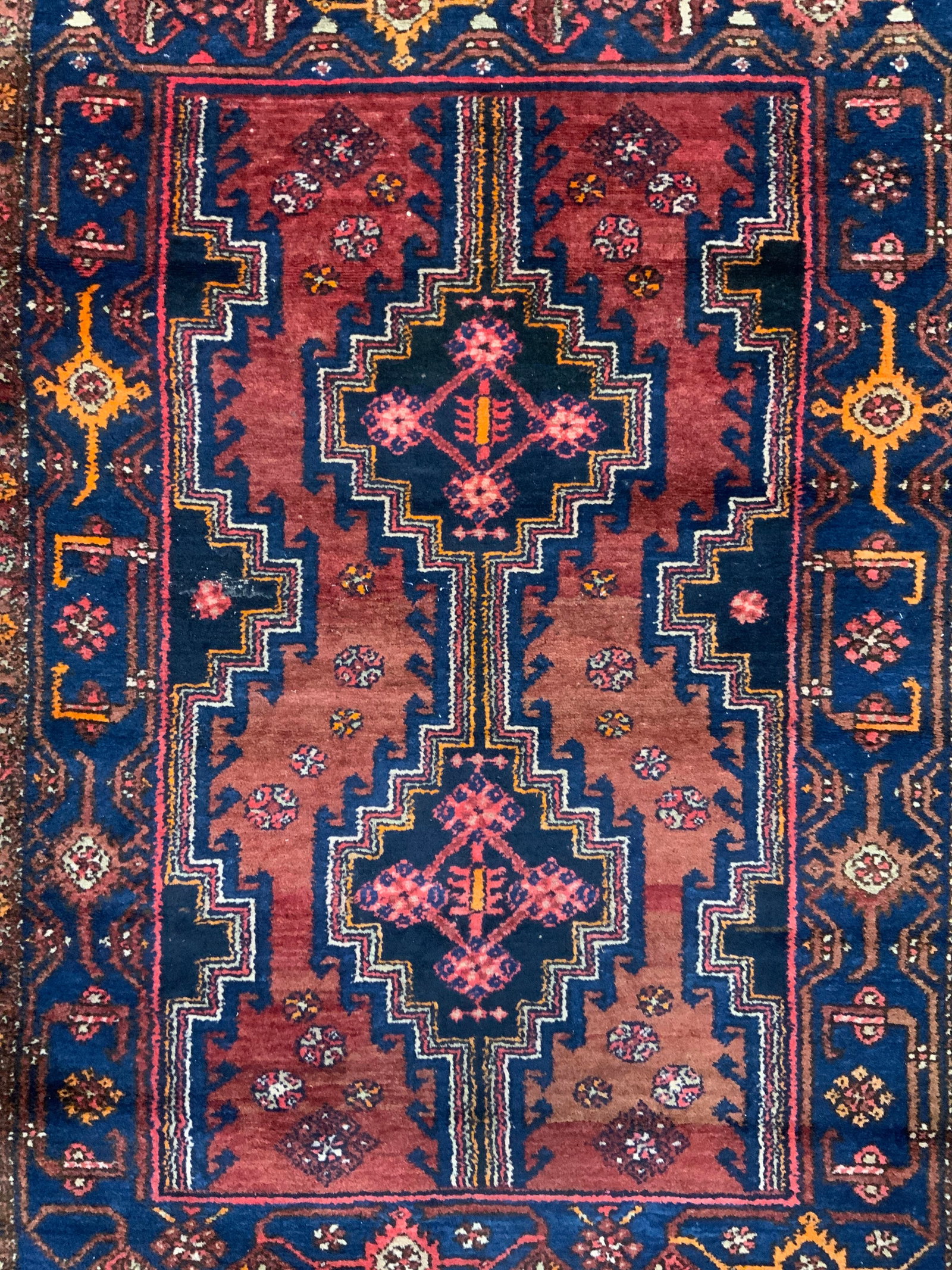 Vintage Handmade Persian Wool Rug: Rug is handmade and wool. Piece appears to be Persian. Rug has intricate multi toned geometric detail. Rug measures approximately 63 inches long 44 inches wide. Rug, carpet, area rug, wool rug, handma