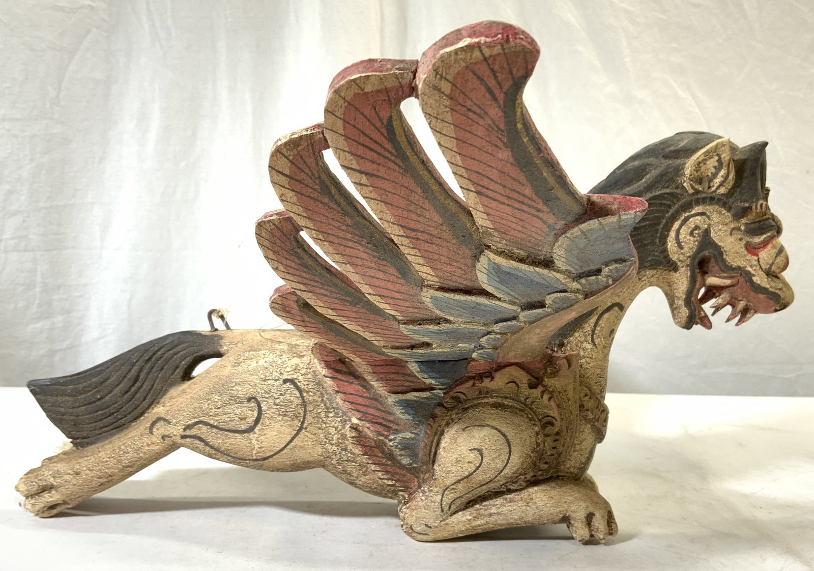 Vtg Singa Bersayap Wood Balinese Lion Deity Sculpt: Vintage Singa Bersayap Wood Balinese Winged Lion Deity. Sculpture is vintage and wooden. Piece appears to be hand crafted. Sculpture has detachable wings. Top of piece has metal areas with string atta