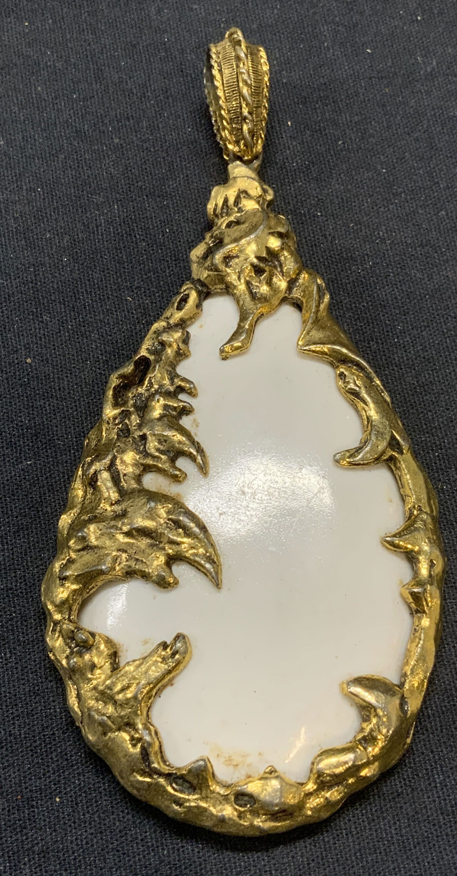 Attr. JULIANA XL Gold Tone White Lucite Pendant: Attributed to Juliana vintage gold tone and white lucite pendant. Unsigned. Measures approx. 4.5 x 2 inches. Some surface wear including loss to finish and scratching observed. Estate jewelry, costume